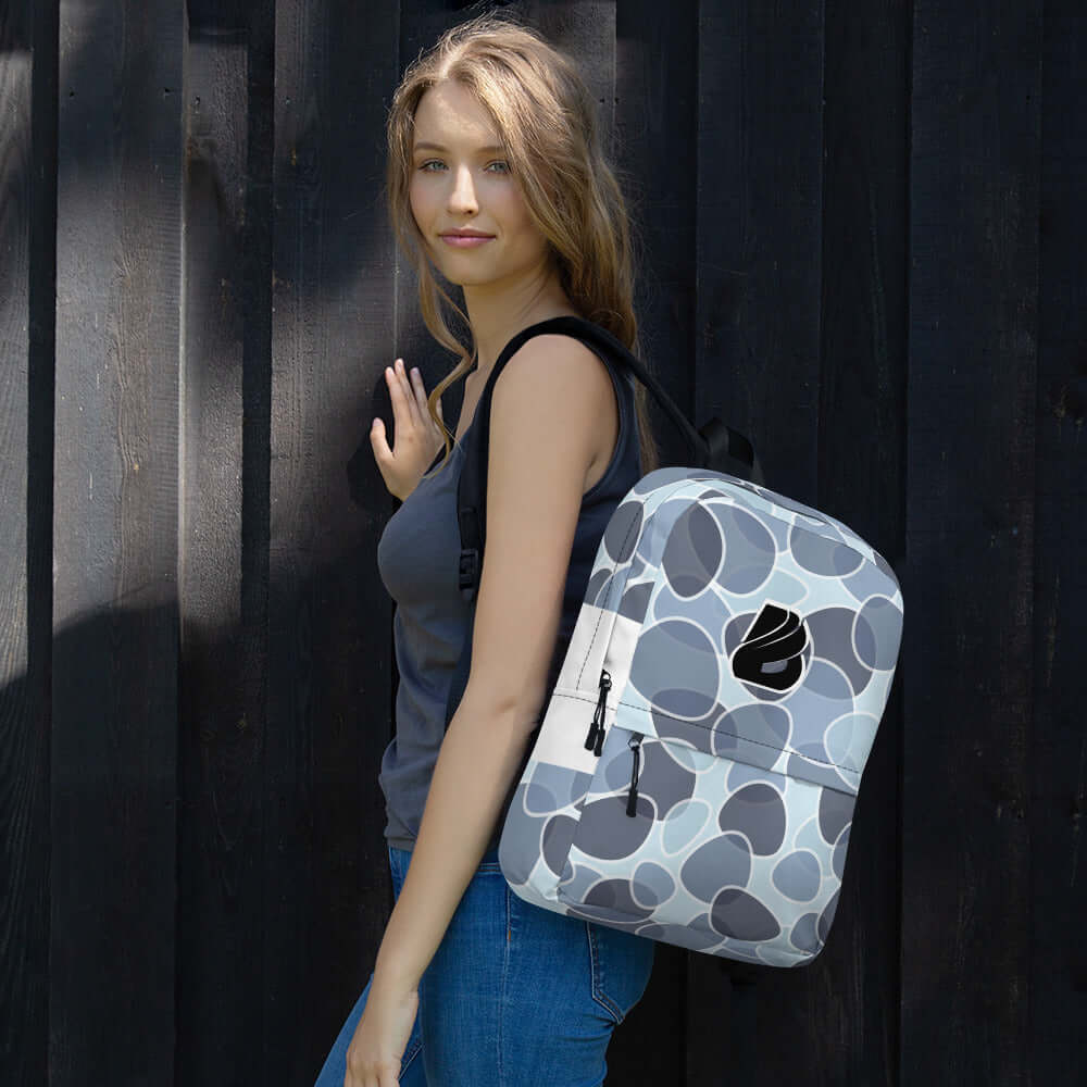 Woman wearing Rucksack N°5, a stylish, weatherproof backpack suitable for daily use, featuring ample space and modern design.
