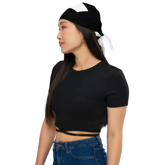 Woman wearing Bandana N°1 as a headband, stylish black and white microfiber accessory ideal for adding flair to outfits.