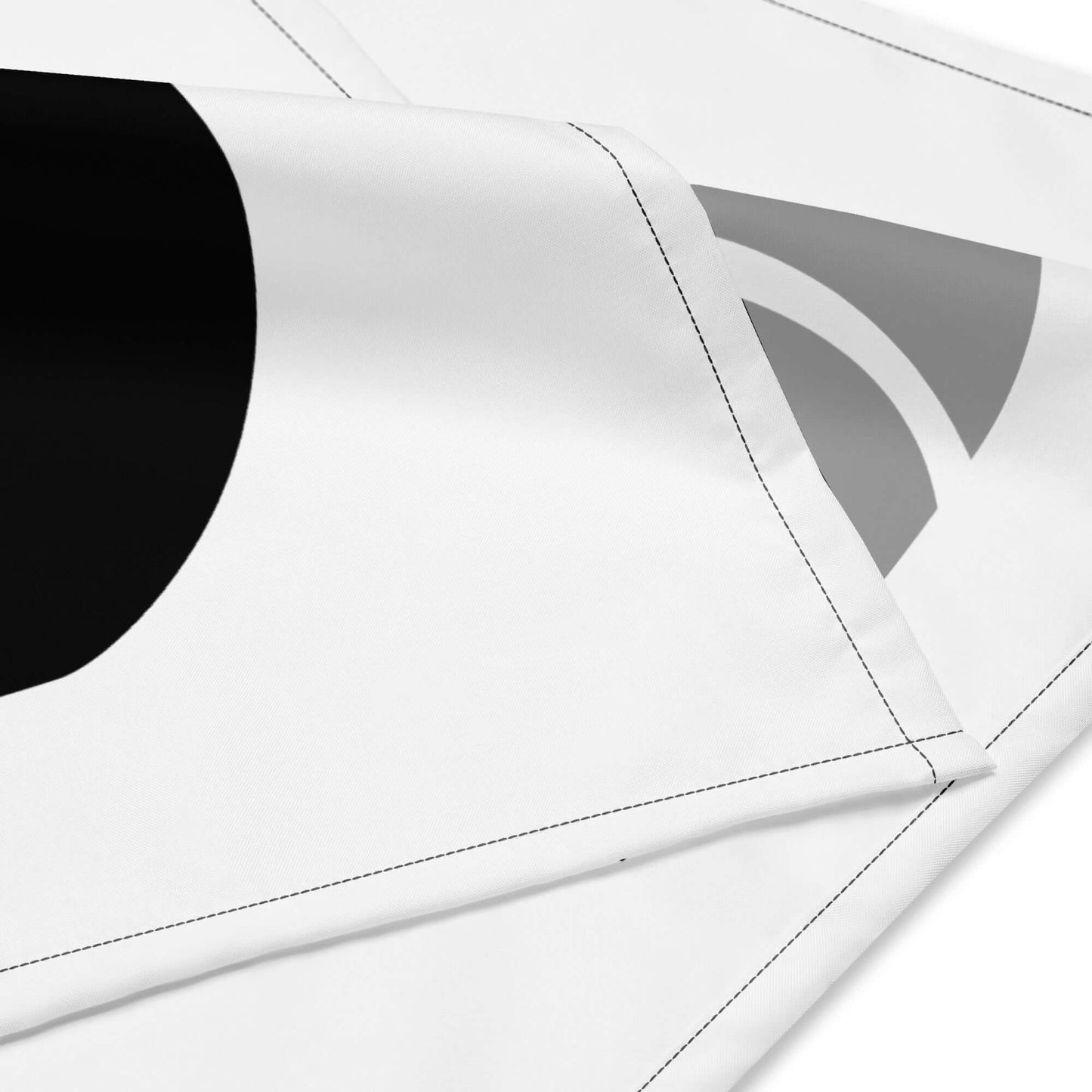 Close-up of Bandana N°1 with black and gray geometric design on microfiber polyester fabric.