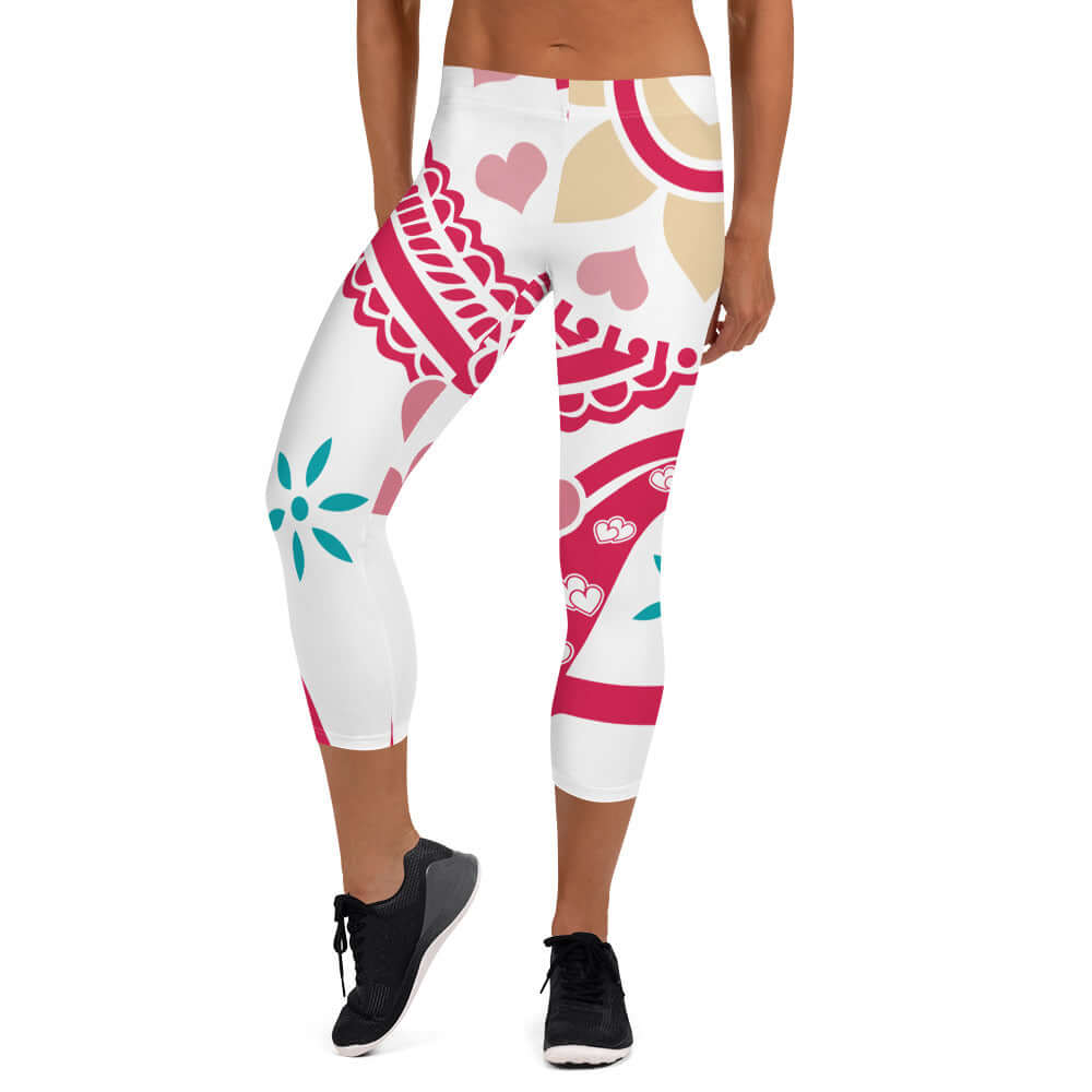 Woman wearing Capri-Leggings N°4 with colorful patterns, showcasing four-way stretch fabric and UV protection.