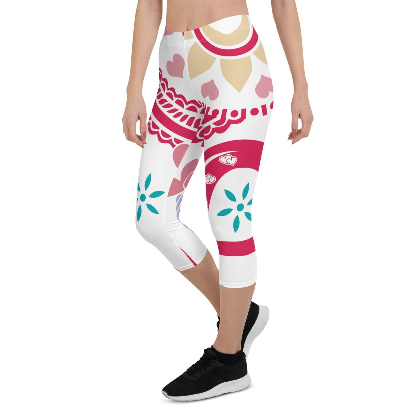 Model wearing Capri-Leggings N°4 with colorful floral patterns, featuring UV protection and four-way stretch fabric for comfort and style.