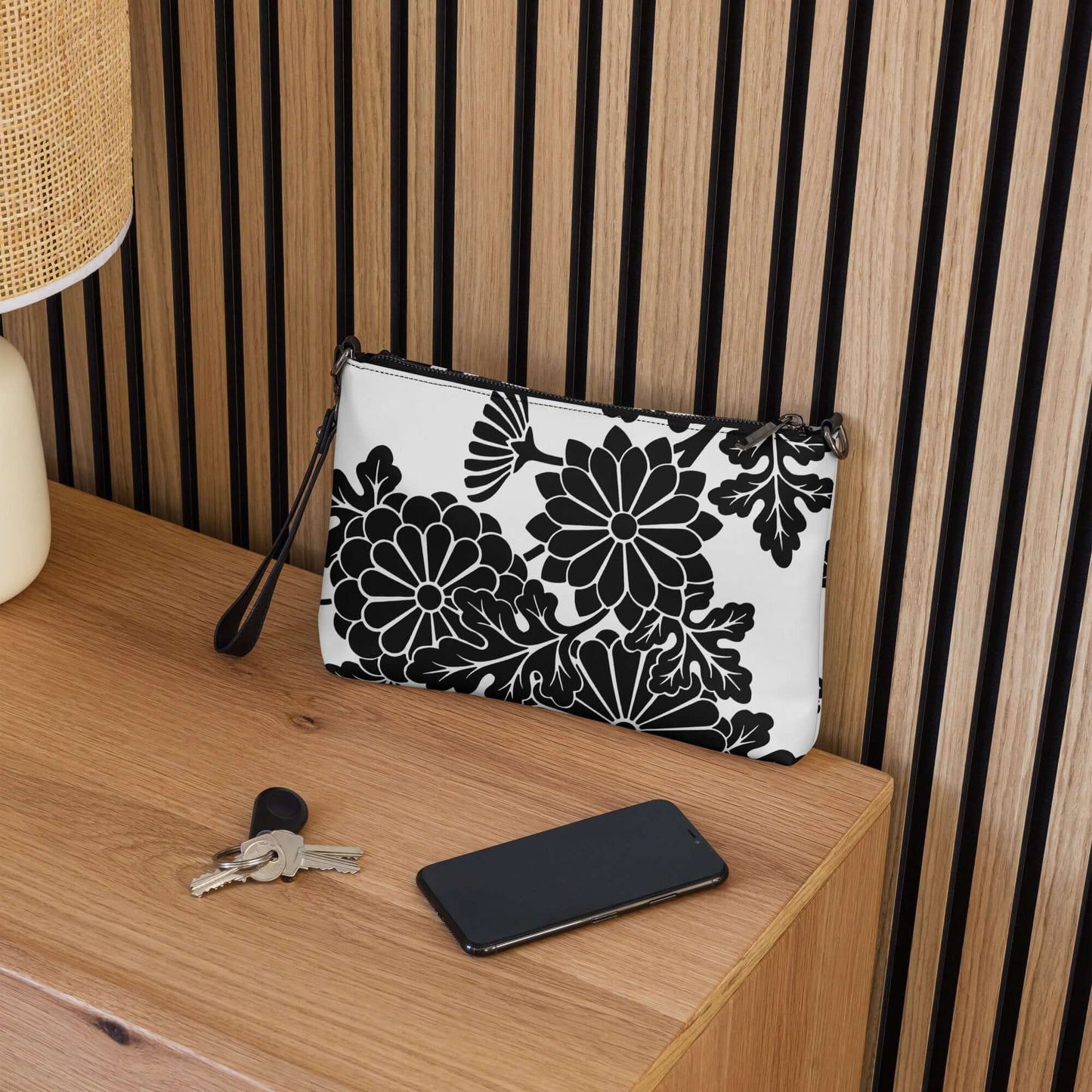 Stylish floral print pouch on a wooden table next to keys and a smartphone, perfect for organizing essentials.