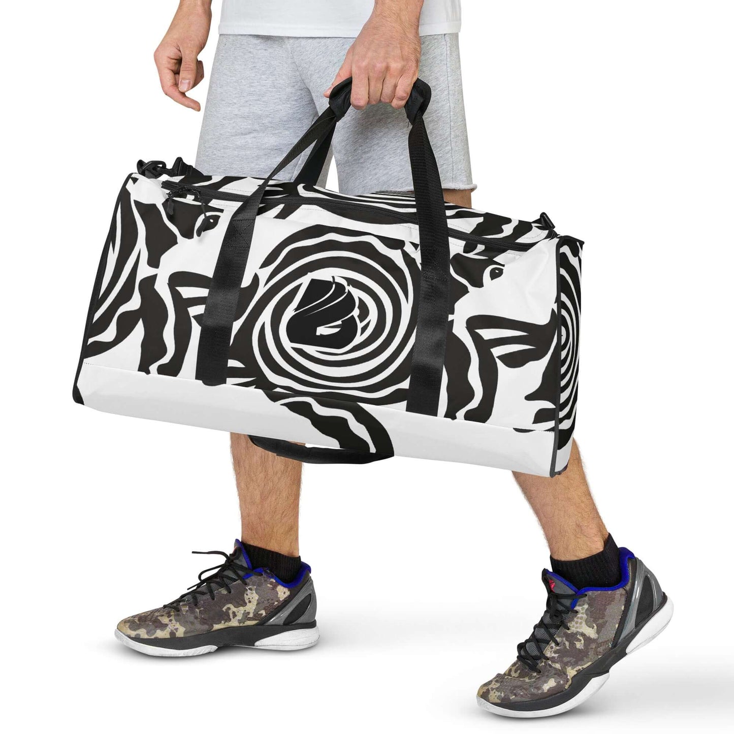 Person carrying stylish Weekender N°28 with black and white pattern, ideal for travel, errands, and gym use.