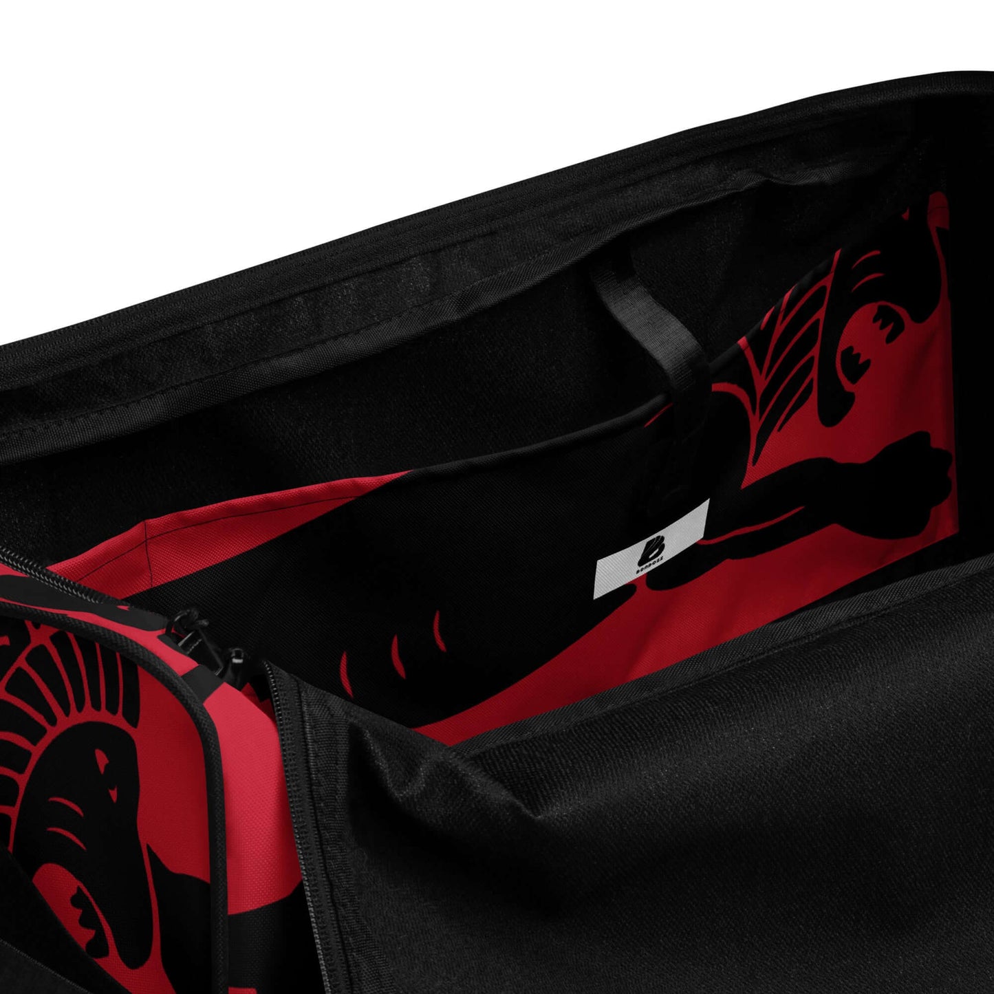 Interior view of Weekender N°26 bag showcasing spacious compartments and red patterned lining with zippered pocket for valuables.