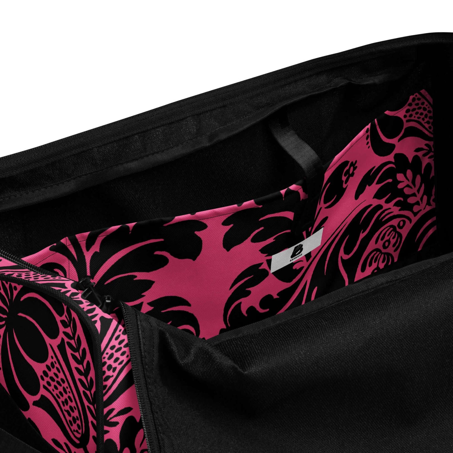 Interior view of Weekender N°29 bag showcasing spacious compartments and pink patterned lining.