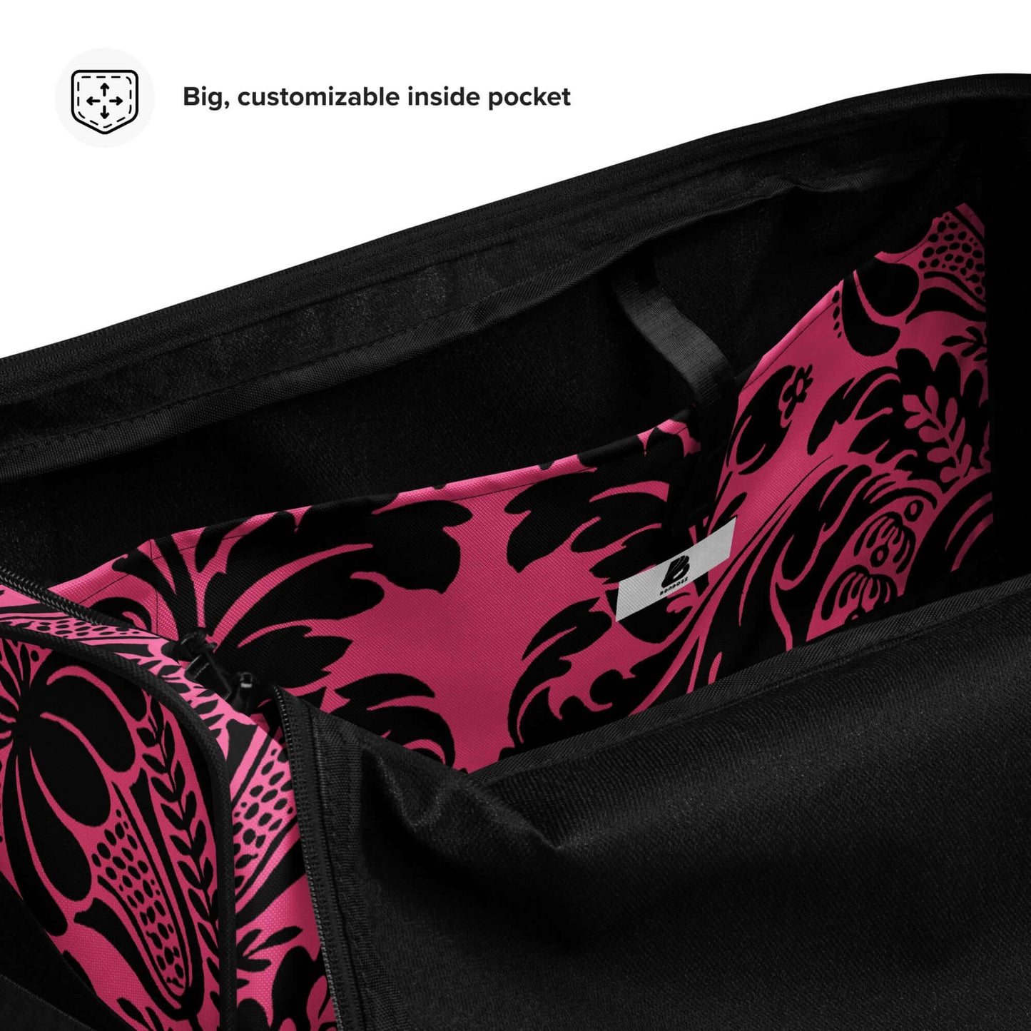 Interior view of Weekender N°29 with customizable pocket, featuring vibrant pink and black floral design. Ideal for travel and gym use.