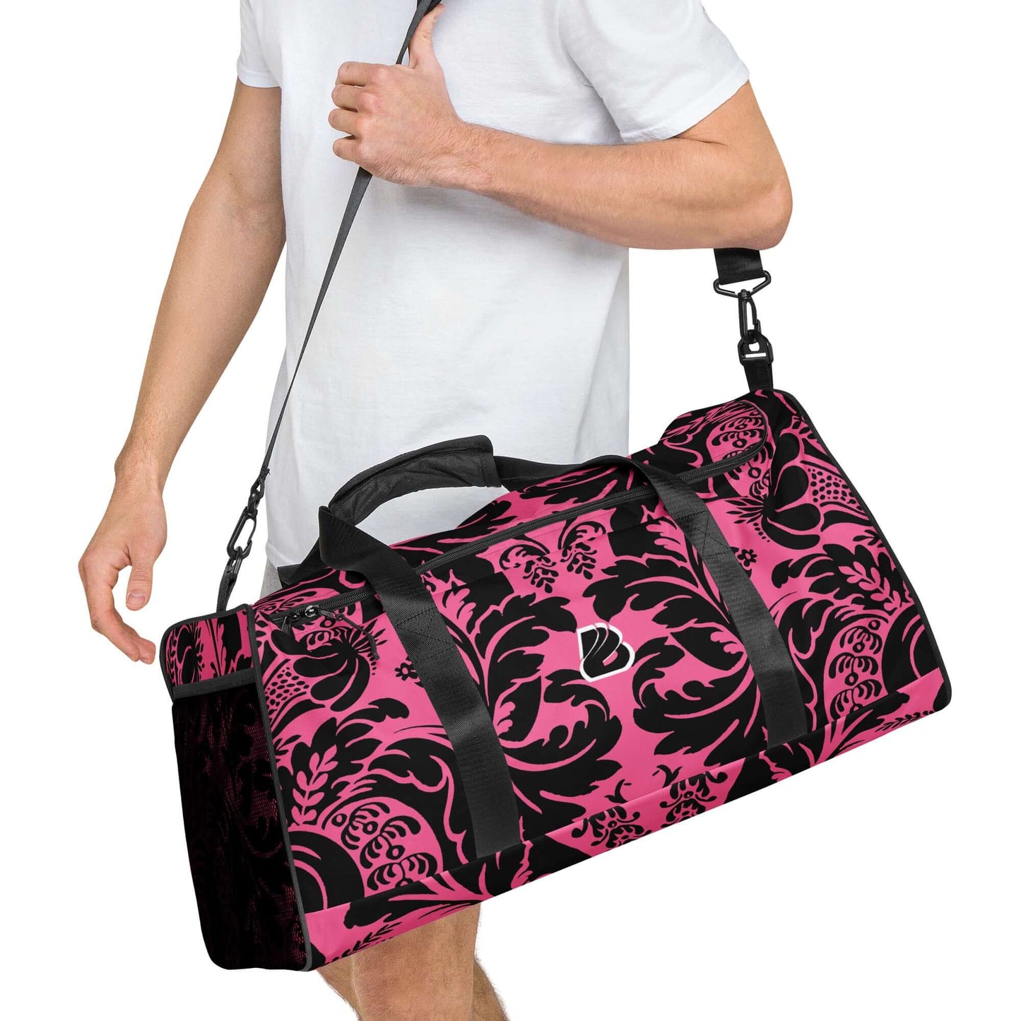 Man carrying a stylish Weekender N°29 in a pink and black pattern, ideal for travel, daily errands, or gym with adjustable shoulder strap.