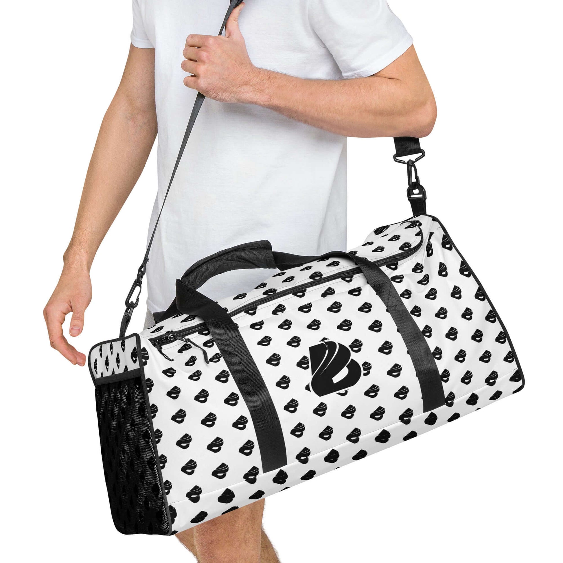 Man carrying Weekender N°30 bag with black and white pattern, ideal for travel, daily errands, and gym; features adjustable padded straps.