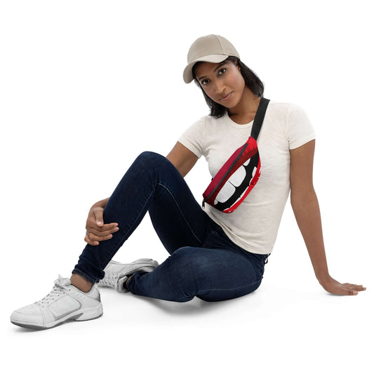 Woman wearing Gürteltasche N°30 with red lip design while sitting, showcasing style and functionality for travel or festivals.