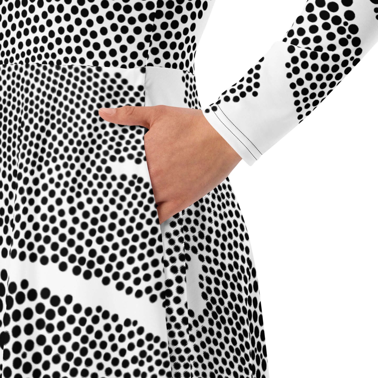 Model wearing Langärmliges Midikleid mit Allover-Druck N°4, showing pocket detail, polka dot pattern, long sleeves.