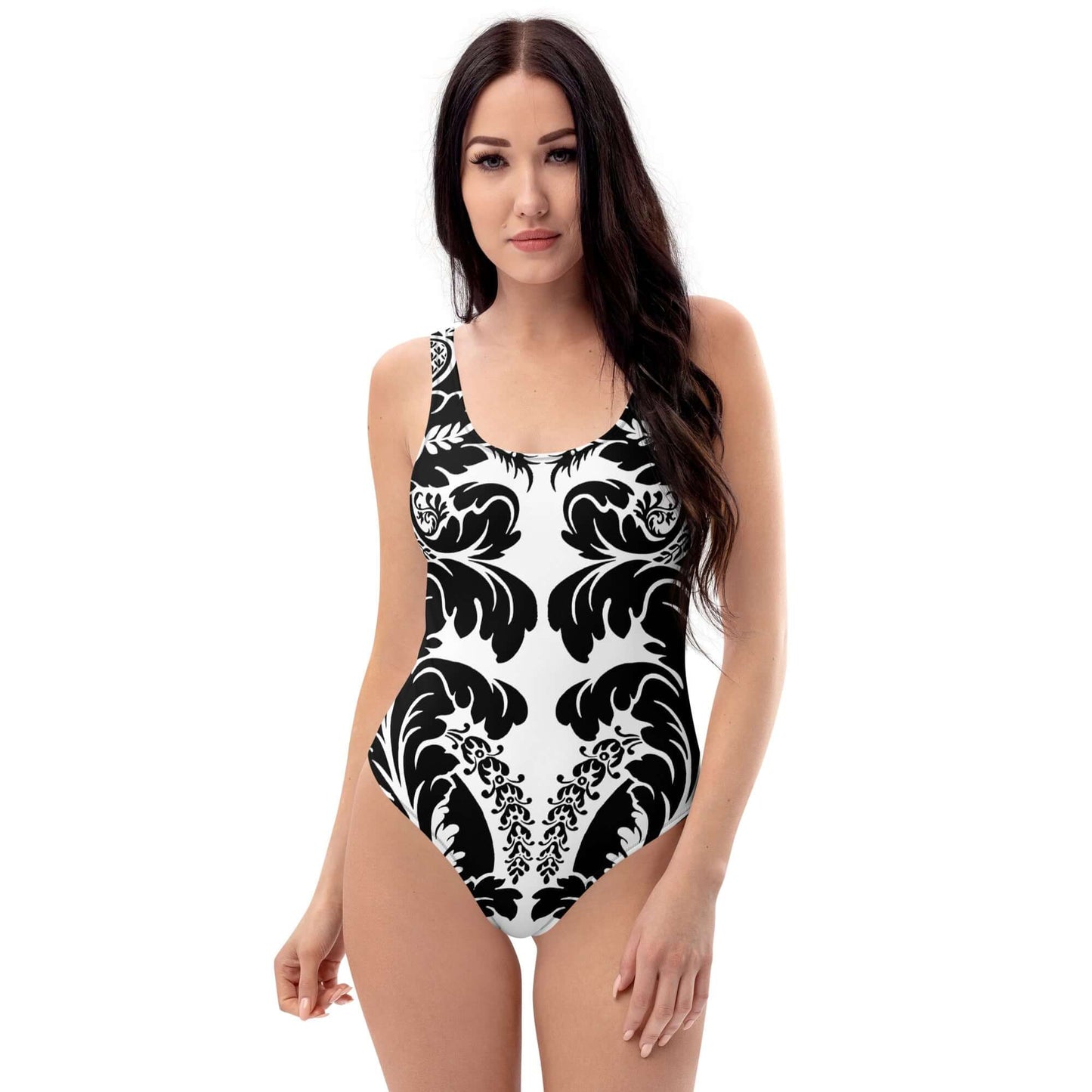 Model wearing Einteiliger Badeanzug N°21 with intricate black and white pattern, U-neck design, and flattering fit for all body types.