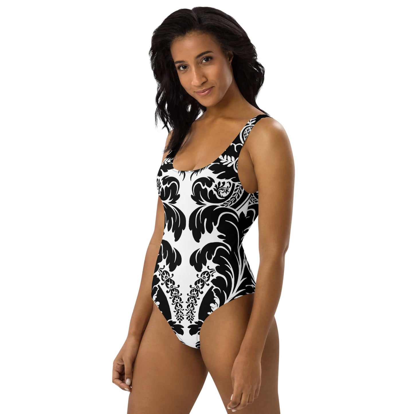 Model wearing Einteiliger Badeanzug N°21 with black and white pattern, flattering fit, U-neck design ideal for beach or pool.