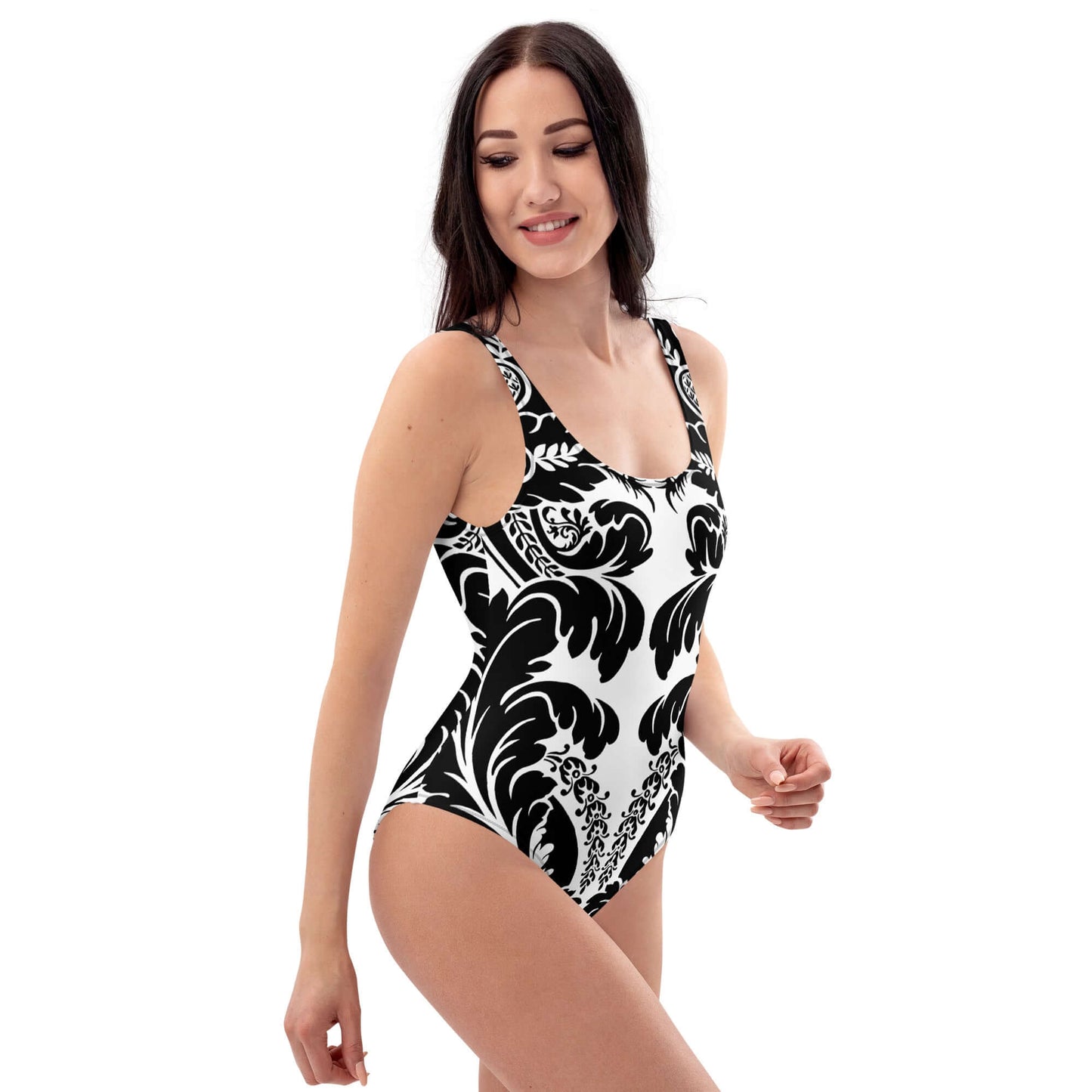 Woman wearing Einteiliger Badeanzug N°21 with elegant black and white pattern, flattering fit, ideal for beach or pool.