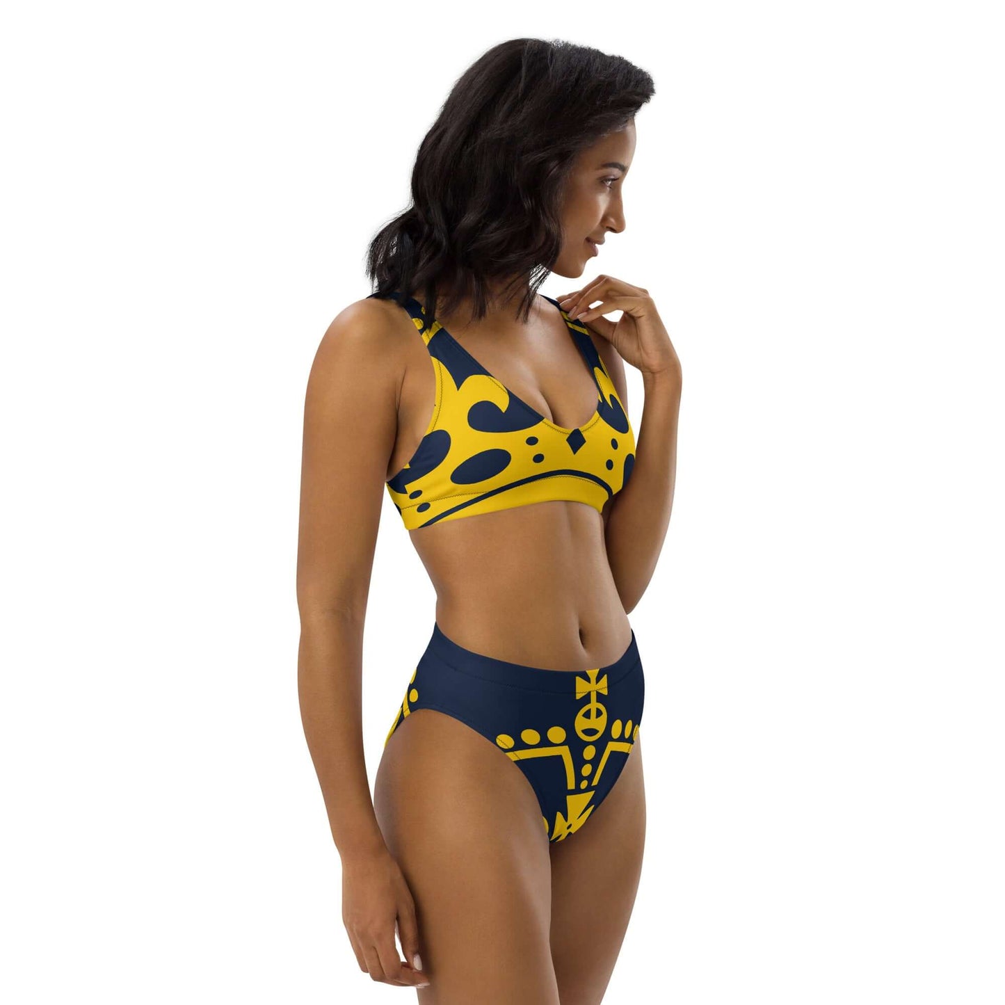 Model wearing Recycelter Allover High Waist Bikini N°1 with vibrant yellow and blue pattern, showcasing sustainable swimwear design.