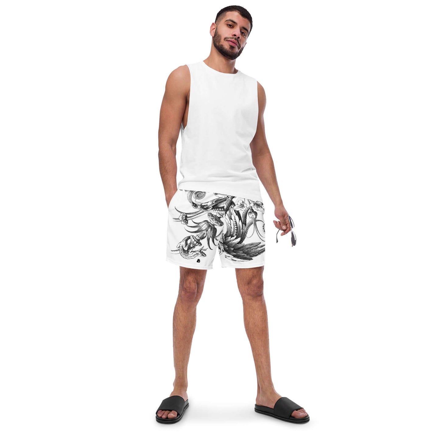 Man wearing Herren-Badehosen N°12, white tank top, black sandals