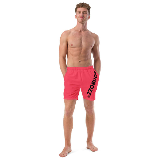 Model wearing Herren-Badehosen N°13, quick-drying pink swim shorts with side pockets and silky lining for summer.