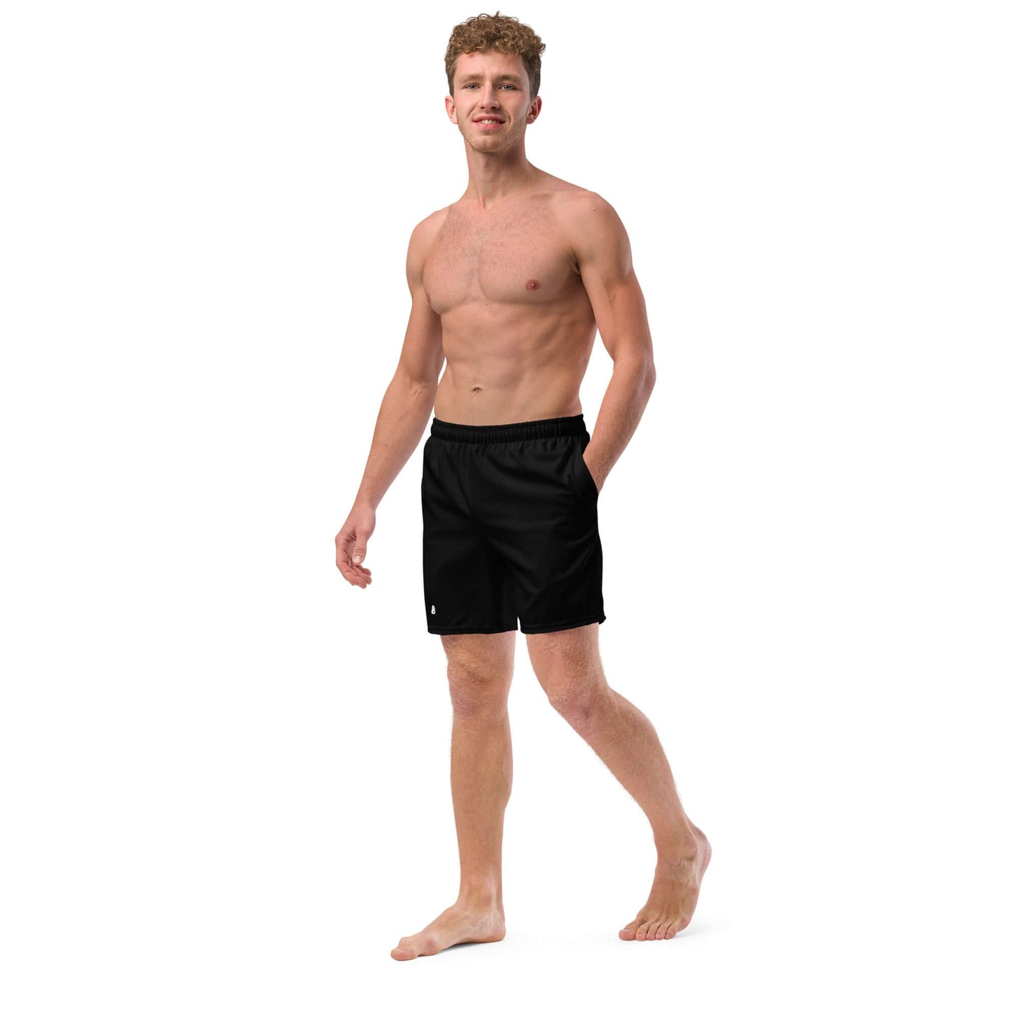 Man wearing Herren-Badehosen N°11, black swim shorts, featuring quick-dry fabric and multiple pockets, ideal for summer.