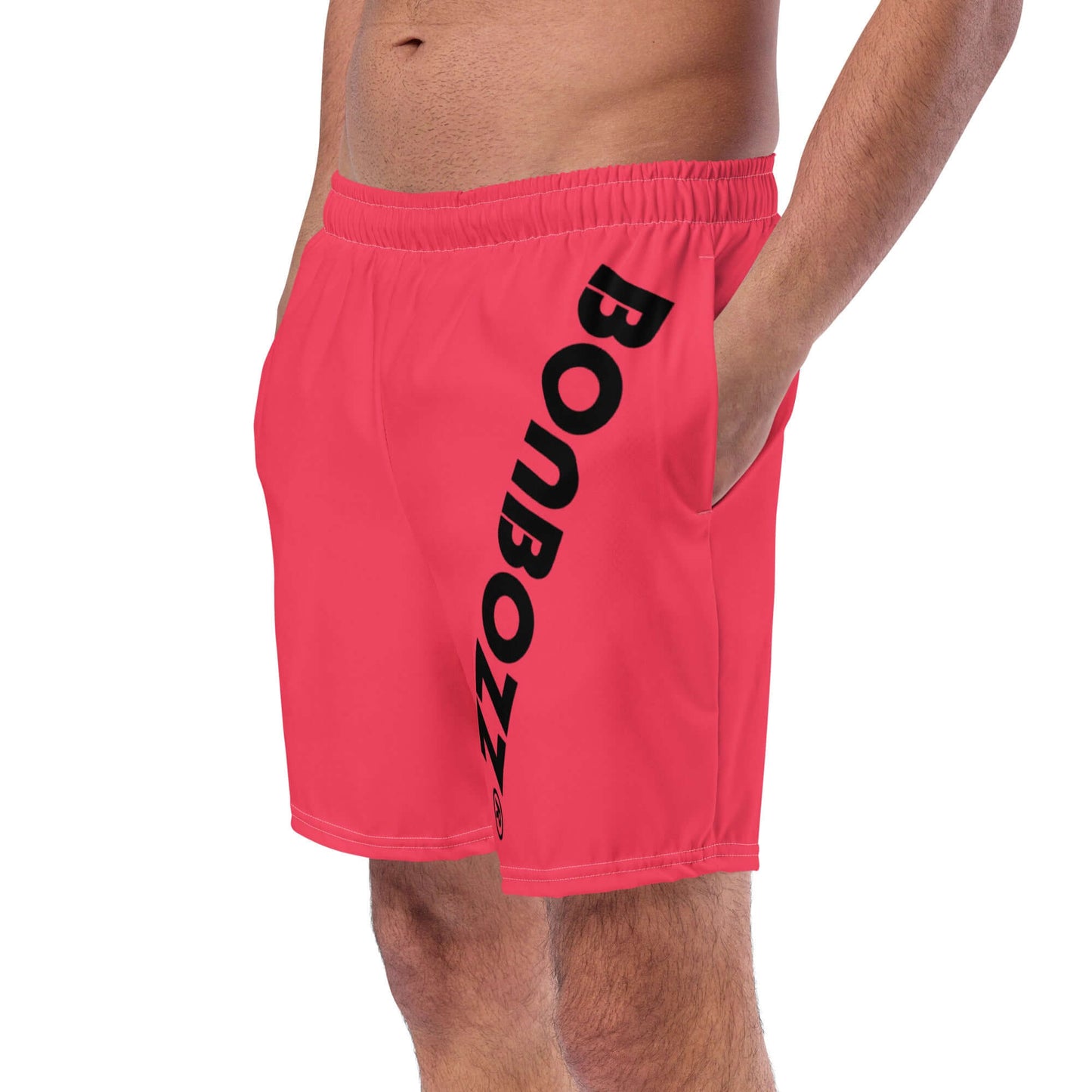Man wearing Herren-Badehosen N°13, featuring quick-drying, breathable fabric with pockets and silky lining for comfort.