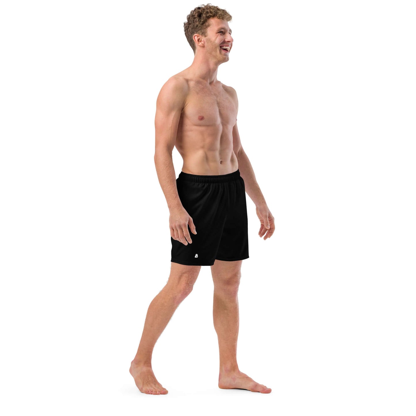 Man wearing Herren-Badehosen N°11, black swim shorts, quick-dry and breathable with pockets, ideal for summer.