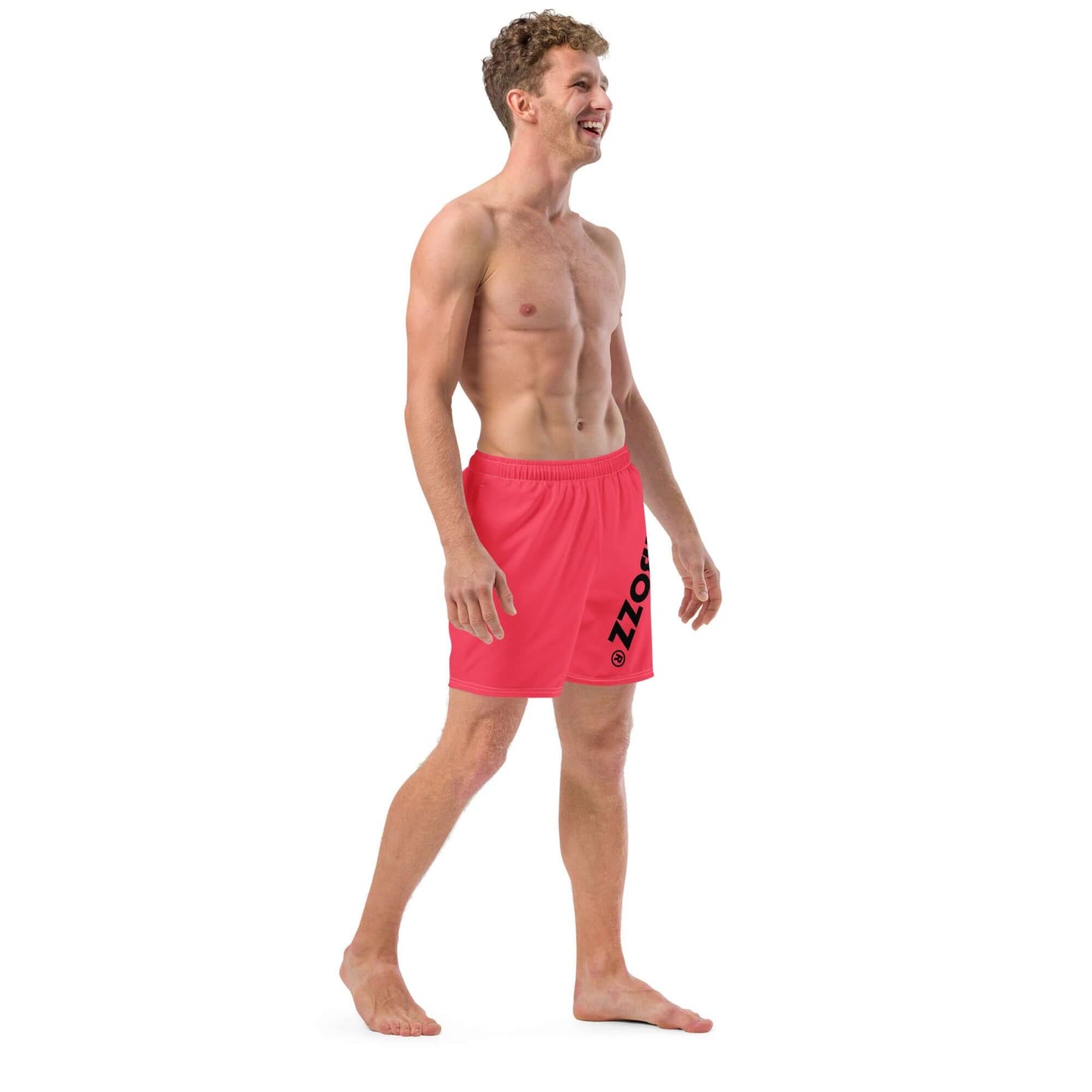 Man wearing Herren-Badehosen N°13, showcasing quick-drying, breathable swim shorts in vibrant red with pockets and silky lining.