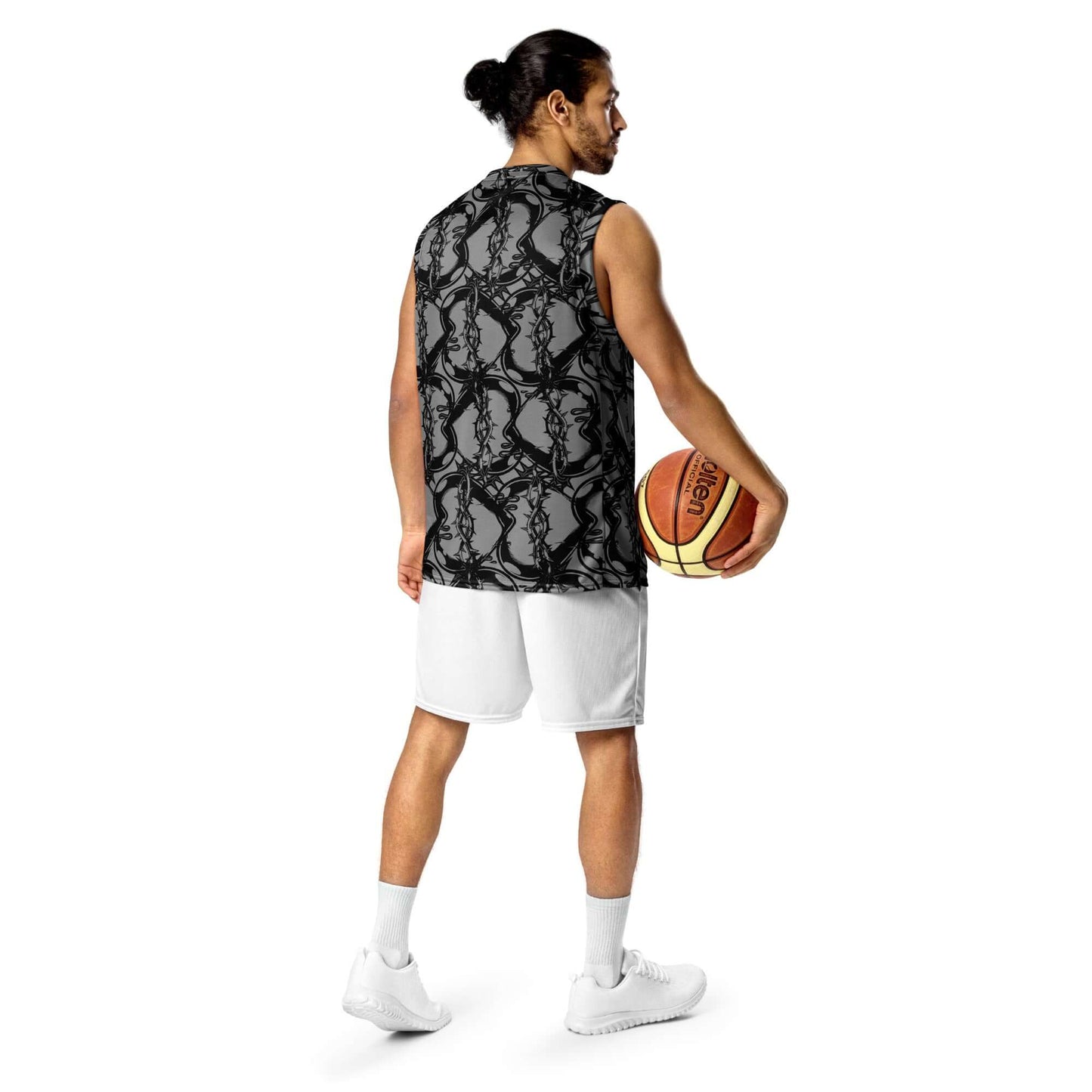Person wearing Recyceltes Unisex-Basketballtrikot N°1 with basketball, showcasing versatile streetwear style