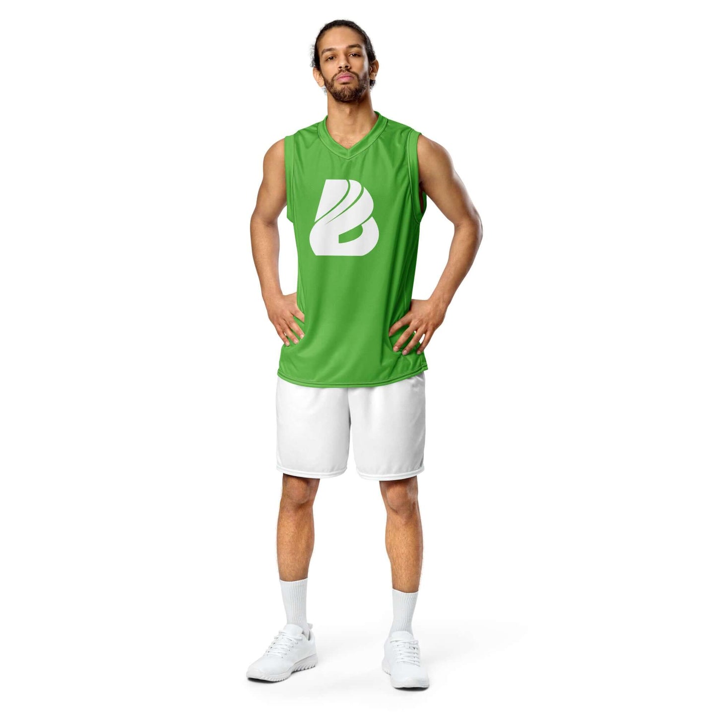 Person wearing Recyceltes Unisex-Basketballtrikot N°2 in green, standing confidently, showcasing eco-friendly sportswear style.