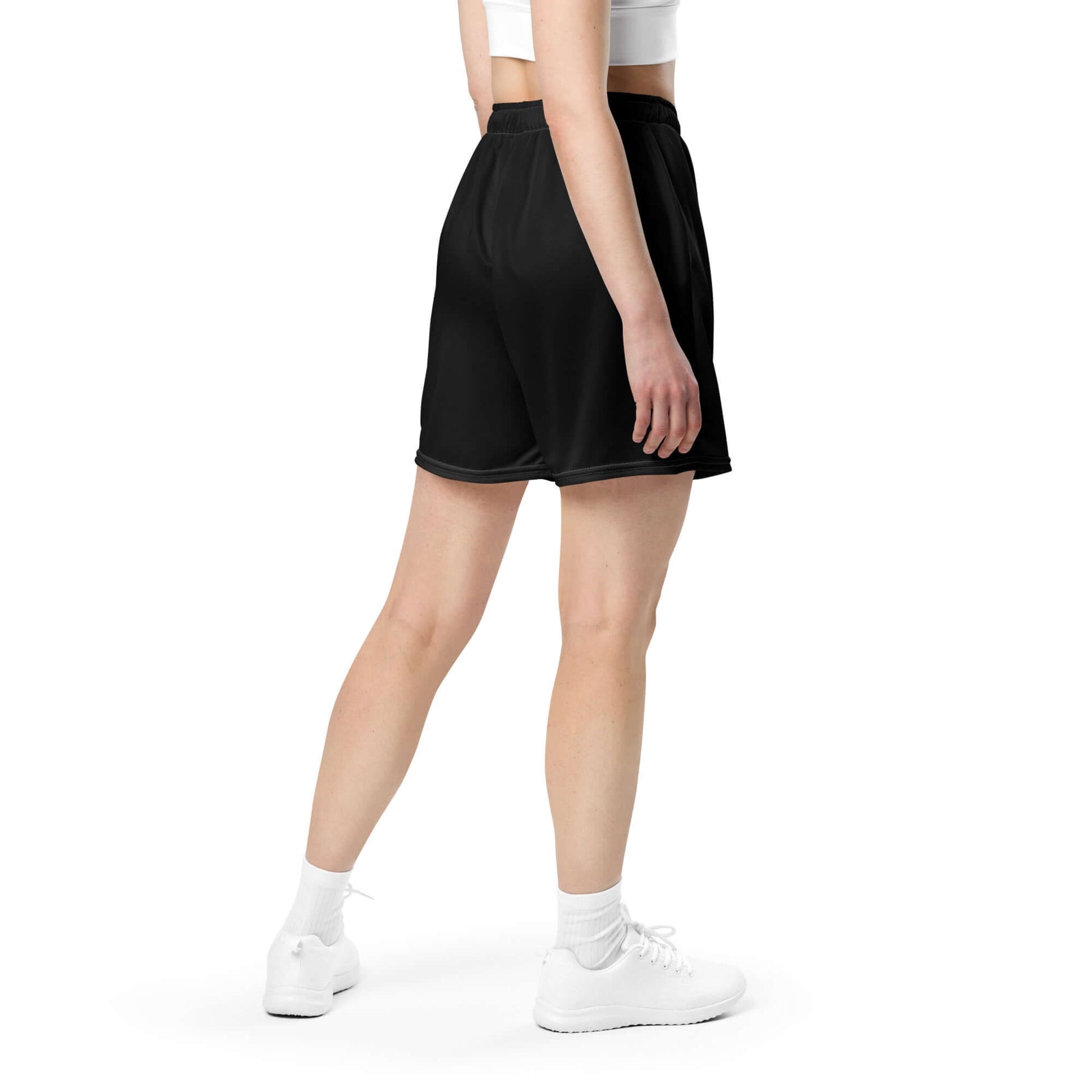 Back view of person wearing Unisex Mesh-Shorts N°0 in black, made from 100% recycled polyester, ideal for gym and casual wear.