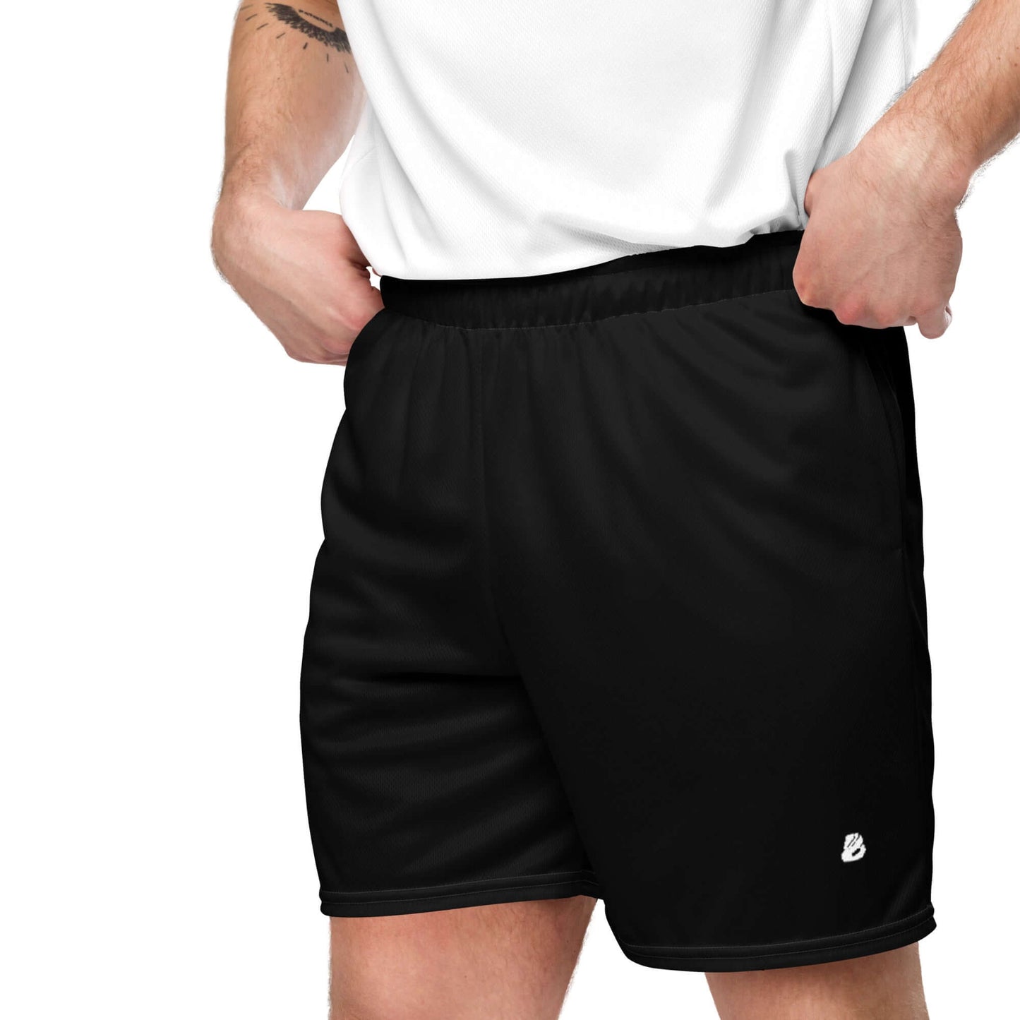 Man wearing Unisex Mesh-Shorts N°0 in black, ideal for gym and casual wear, made from 100% recycled polyester, featuring moist-wicking fabric.