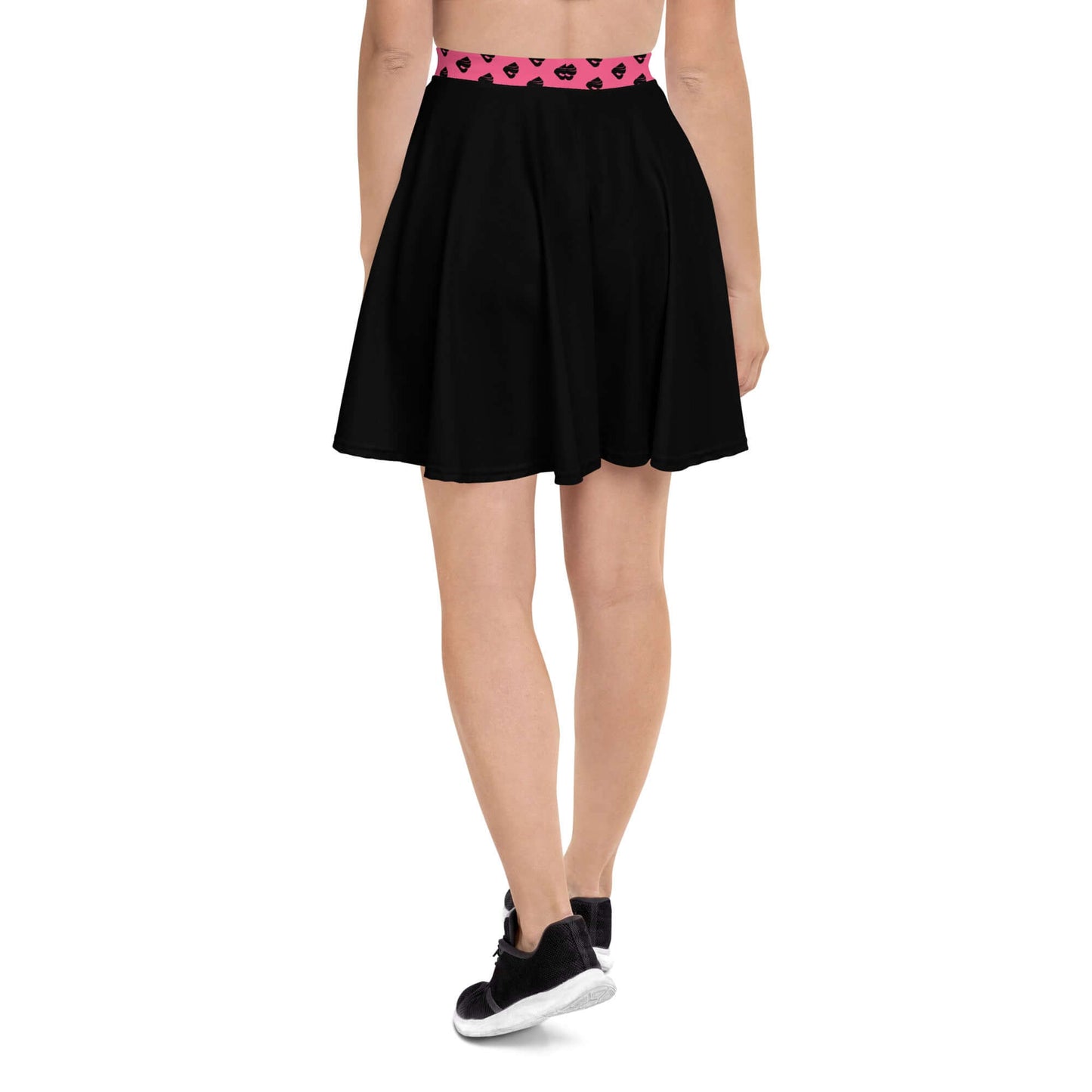 Woman wearing Skater-Rock N°10, a black flared skirt with a printed waistband and sneakers