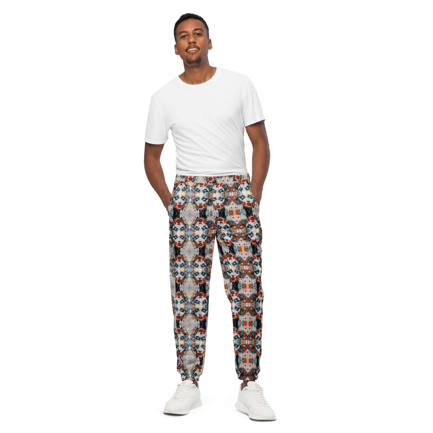 Model wearing Unisex-Trainingshose N°0 with colorful pattern, displaying water-resistant and lightweight material.