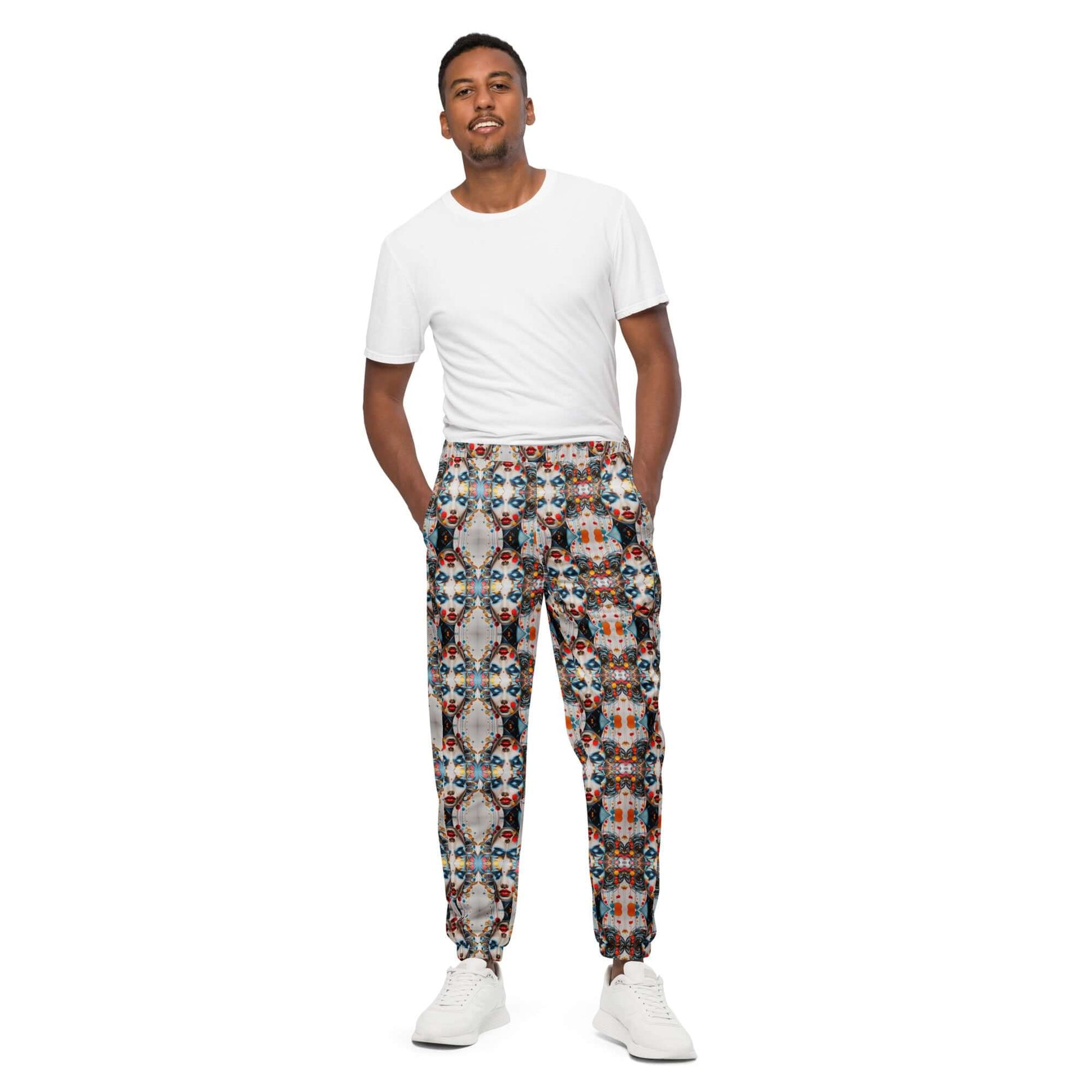 Model wearing Unisex-Trainingshose N°0 with colorful pattern, displaying water-resistant and lightweight material.
