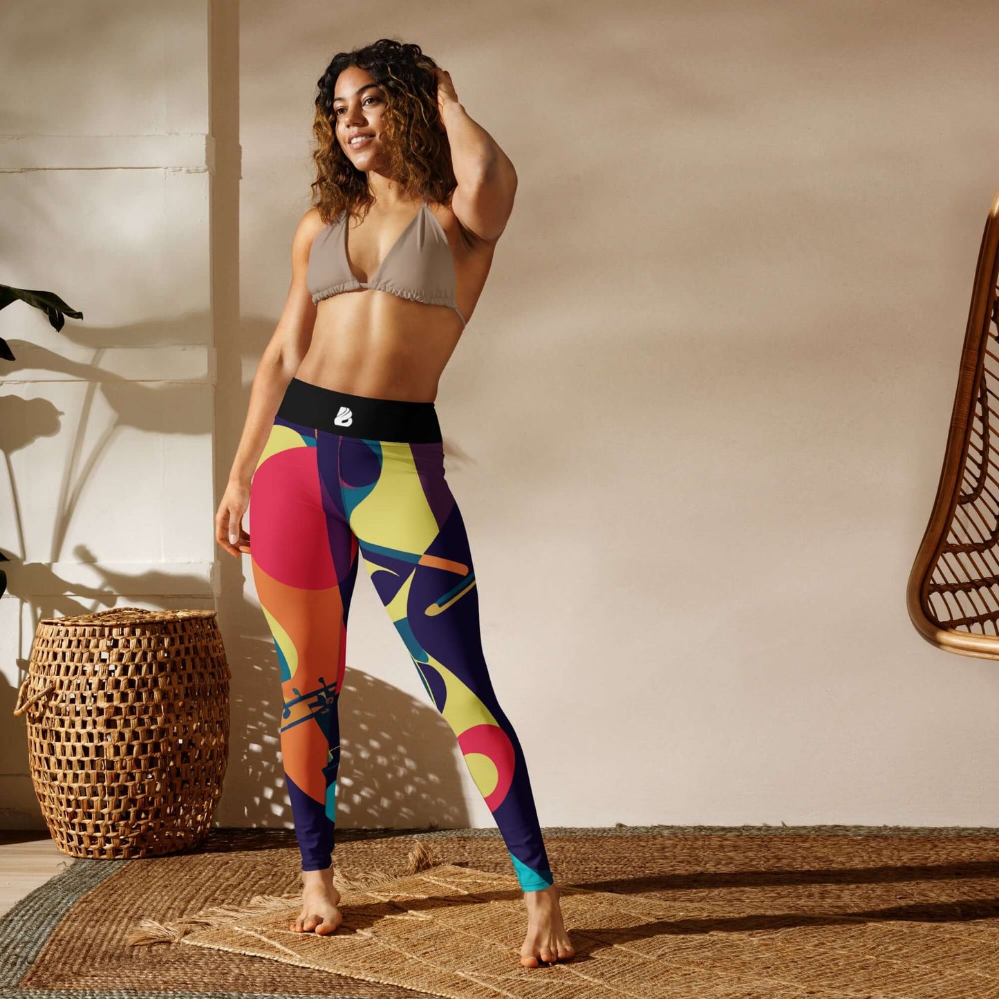 Woman wearing colorful Yoga-Leggings N°46 with high waist, four-way stretch, and smooth microfibre in a bright, sunlit room.