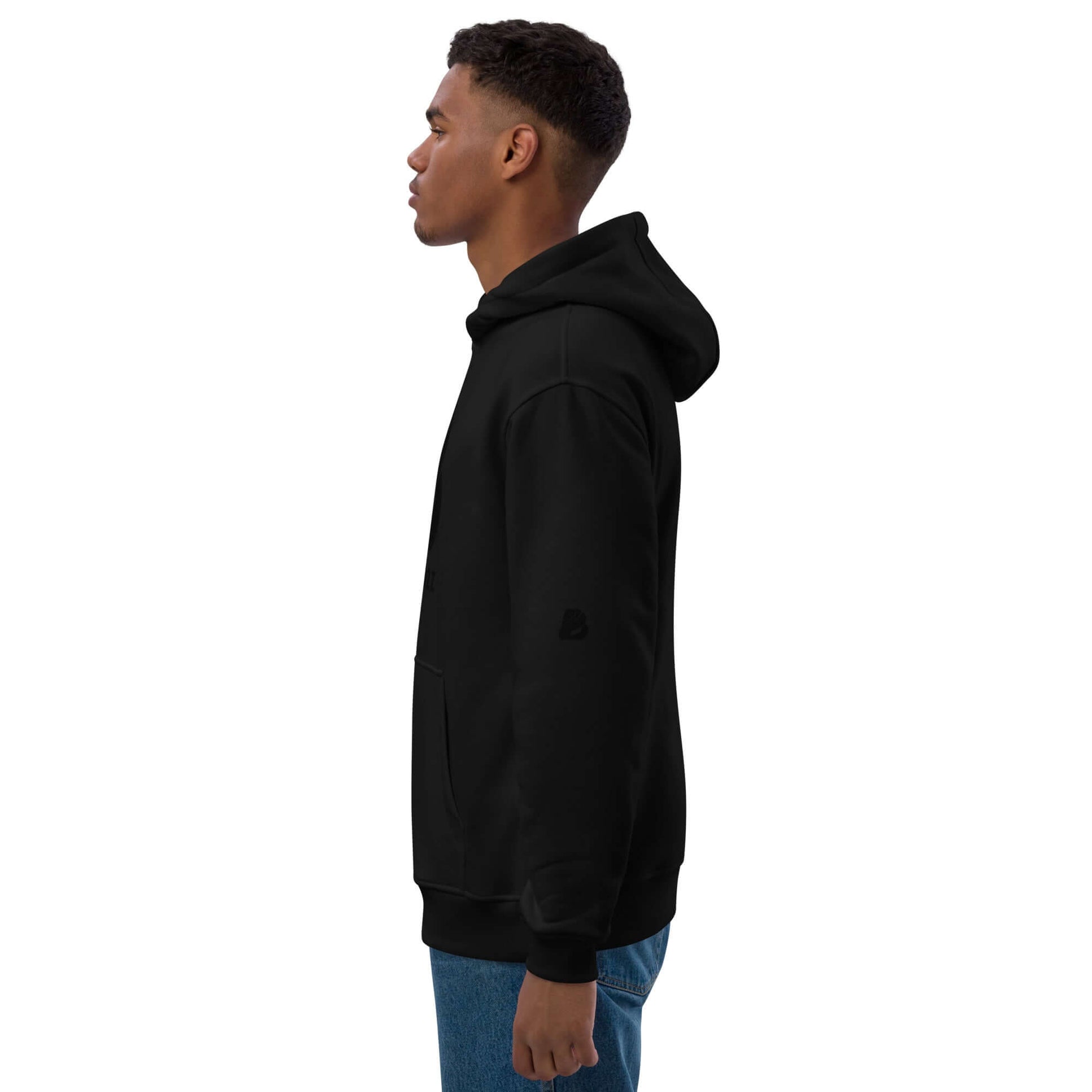 Man wearing Hochwertiger Öko Kapuzenpullover N°13 in black side view