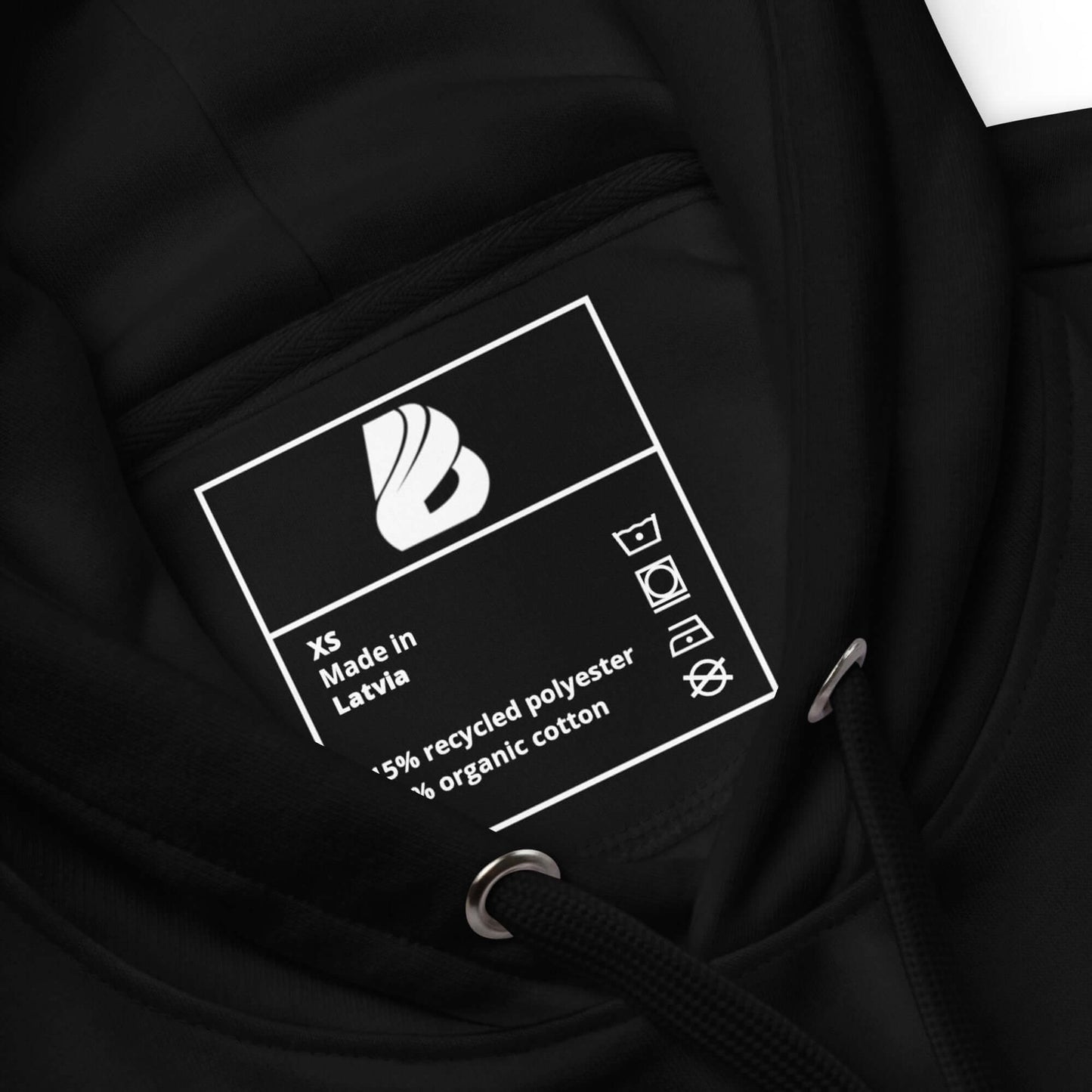Label inside a black eco-friendly hoodie, detailing materials: 85% recycled polyester, 15% organic cotton.
