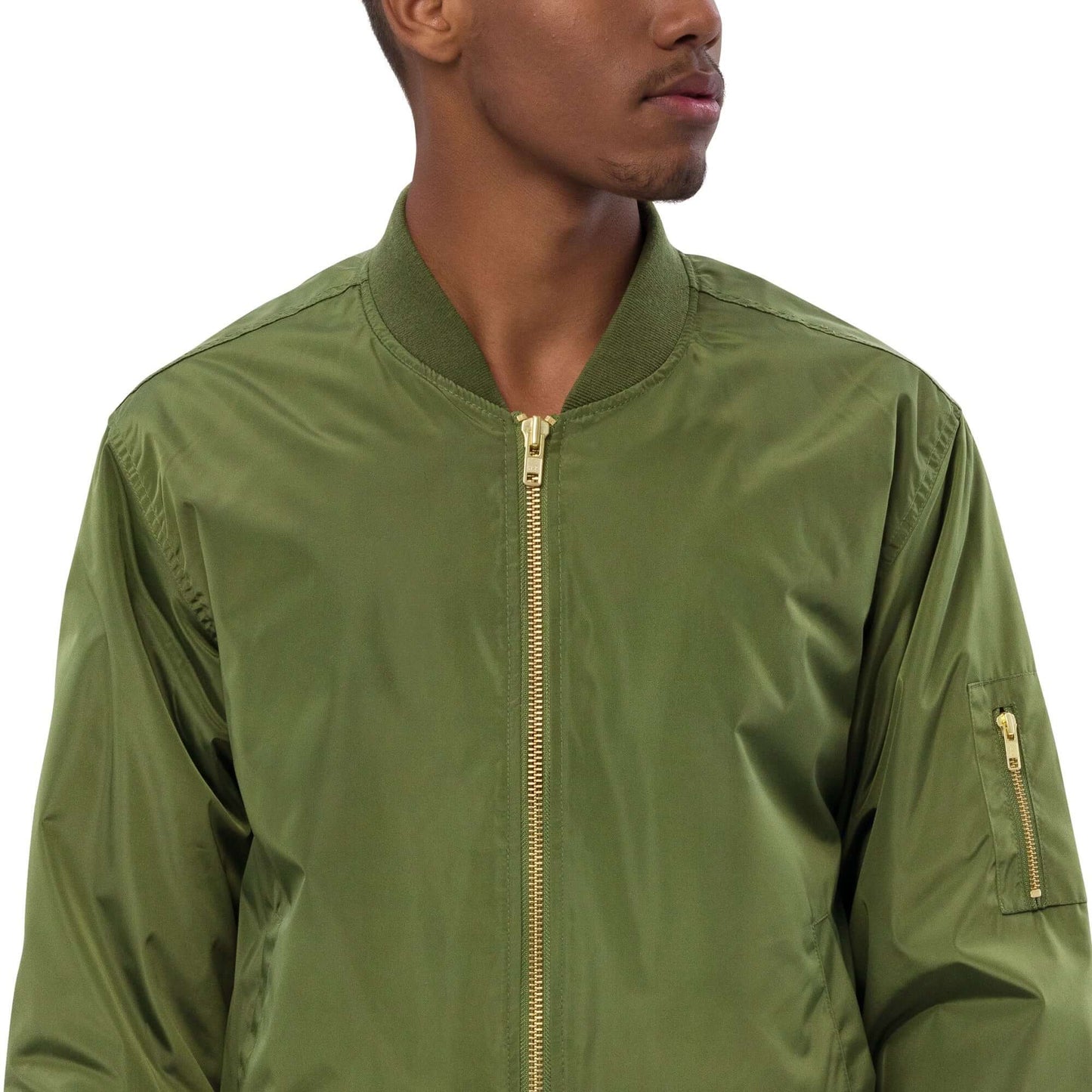 Premium recycled bomber jacket N°0 in green with utility sleeve pocket, relaxed fit, 100% recycled polyester material.