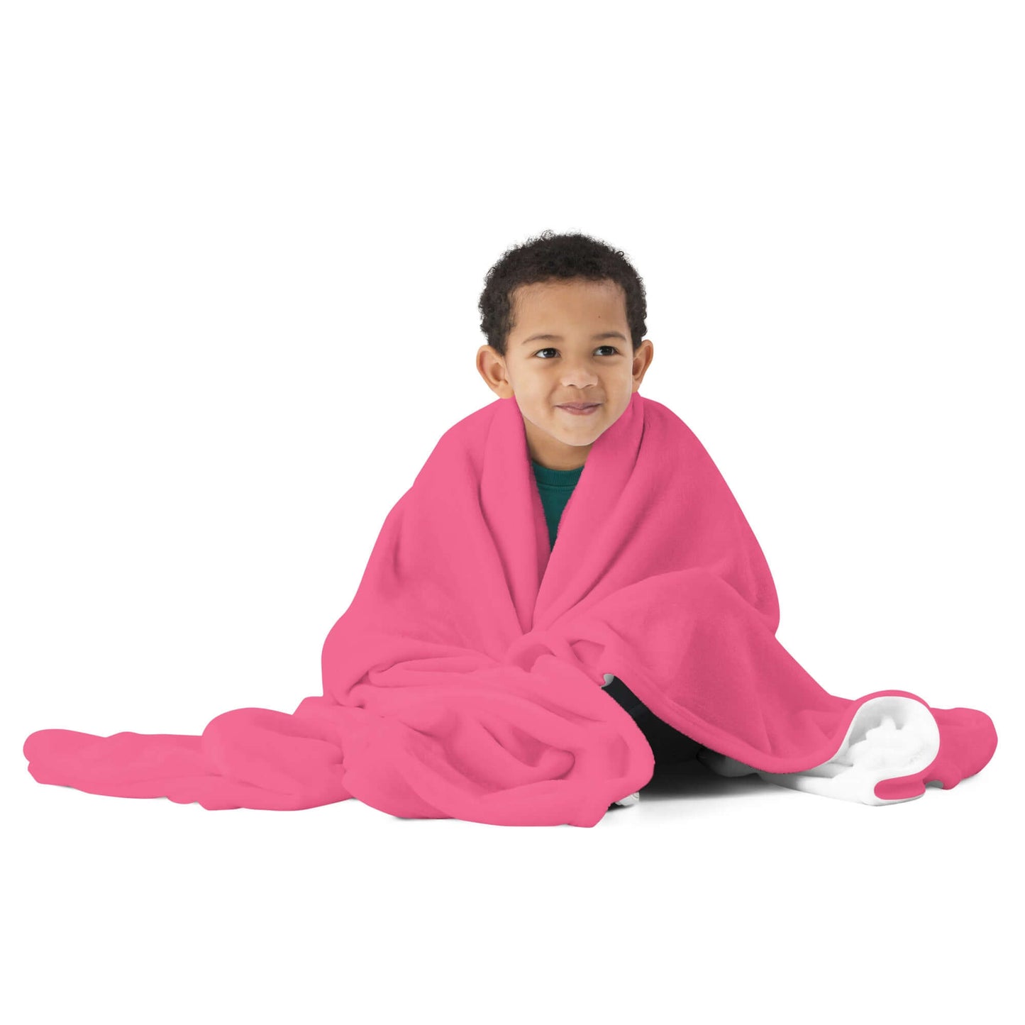 Child wrapped in soft pink Tagesdecke N°3 blanket, showcasing its silky texture and vibrant color, perfect for cozying up at home.