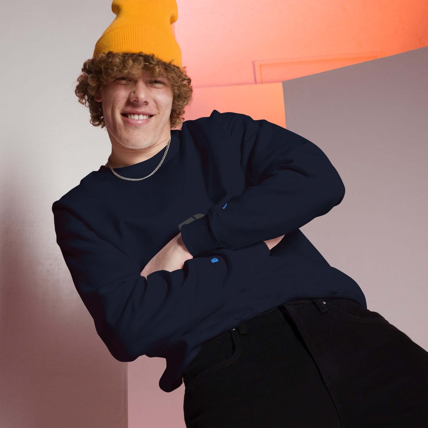Person wearing a warm unisex-pullover and yellow beanie, showcasing a casual look.