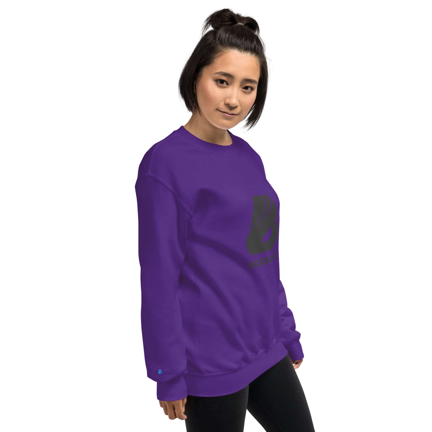 Woman wearing a purple Unisex-Pullover with a printed design, showcasing its classic fit and soft texture, ideal for colder months.