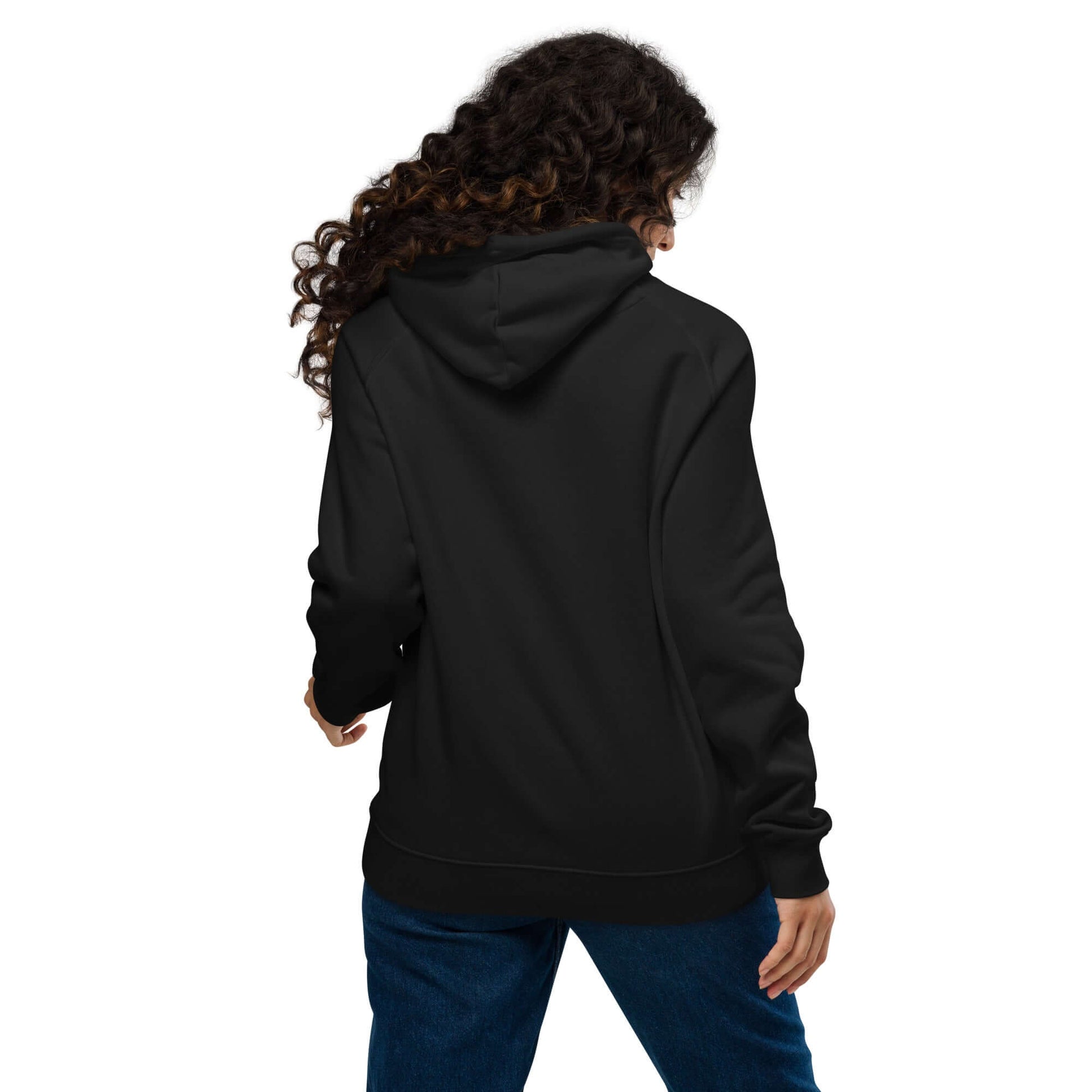 Back view of woman wearing Unisex Bio-Raglan-Hoodie N°5 in black, showcasing its soft material and stylish fit.