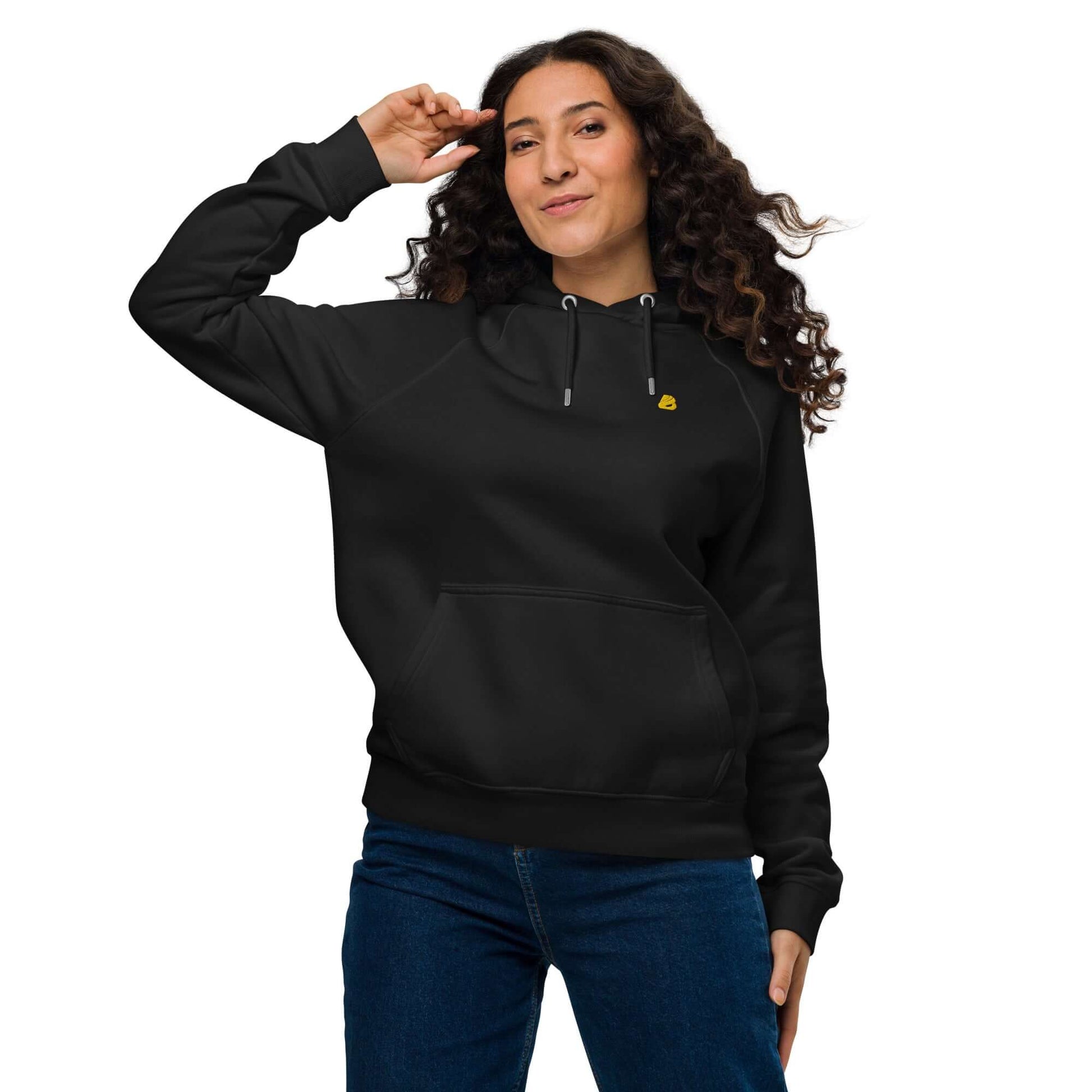 Woman wearing Unisex Bio-Raglan-Hoodie N°5, styled with jeans, showcasing versatile fashion for comfort and style.