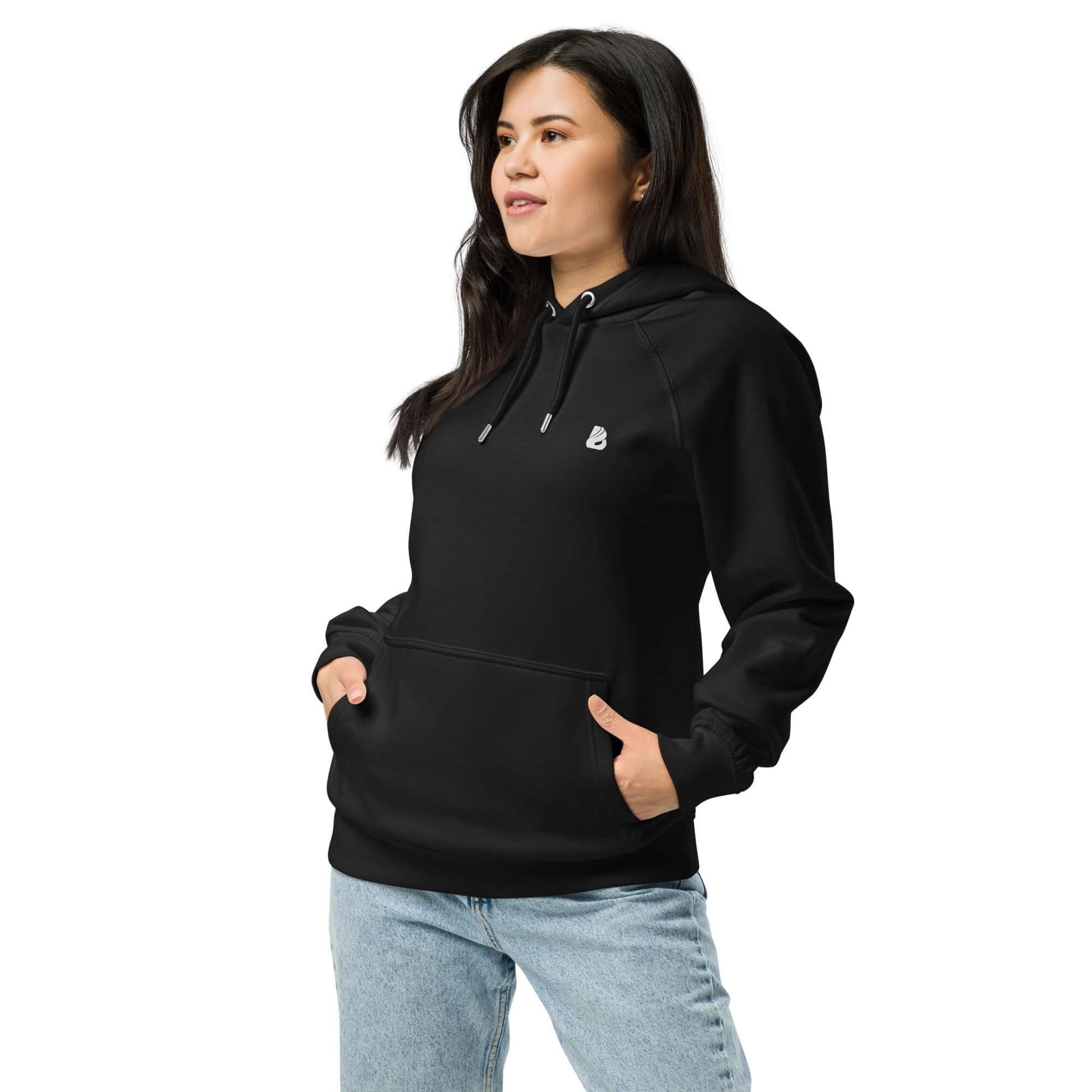 Woman wearing Unisex Bio-Raglan-Hoodie N°4 in black style, paired with jeans for a casual look.