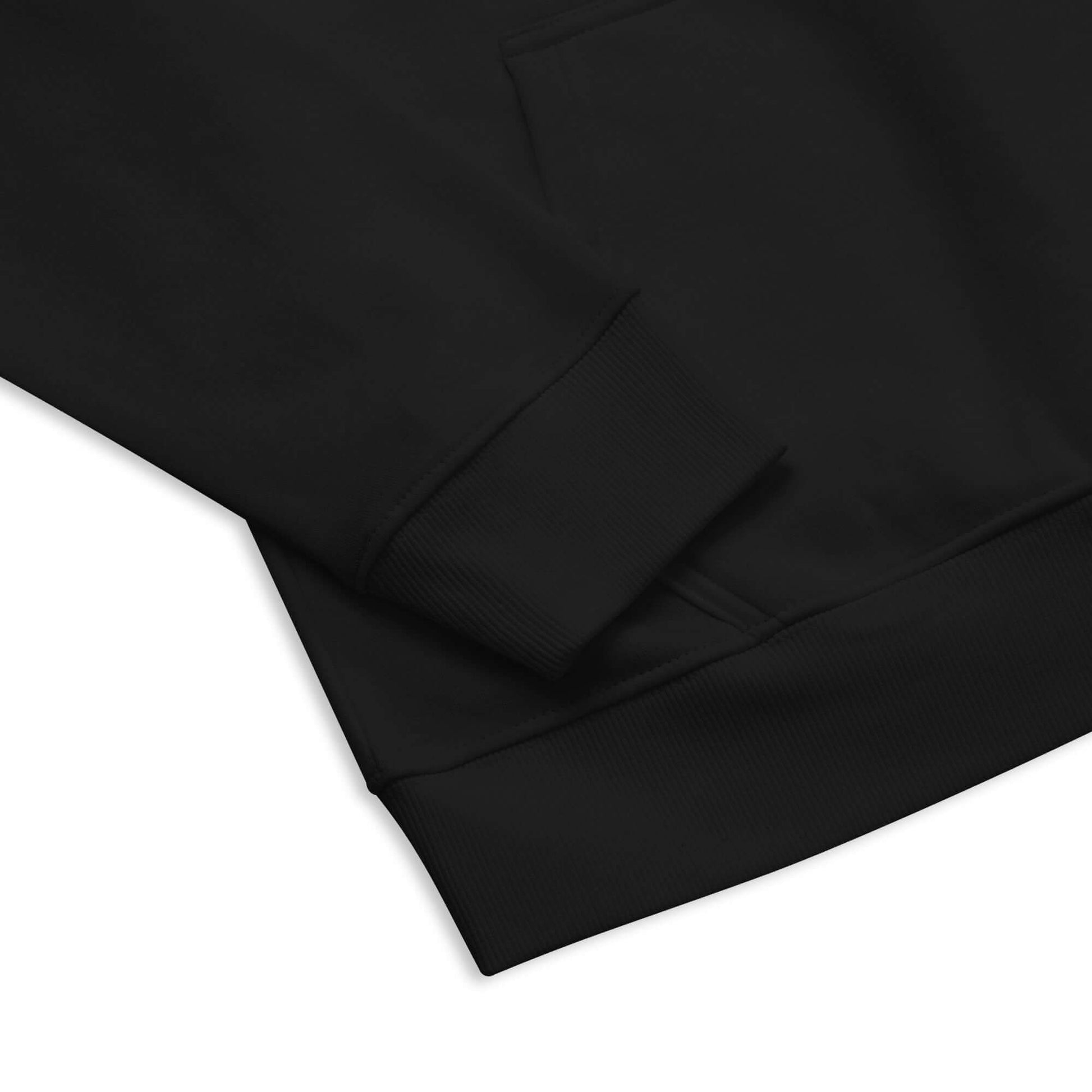Close-up of black Unisex Bio-Raglan-Hoodie N°5 showing cuff and hem details.