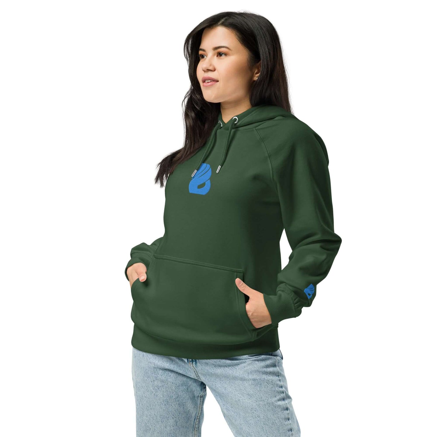 Woman wearing a green Unisex Bio-Raglan-Hoodie N°3 with blue logo, paired with jeans for a casual style.