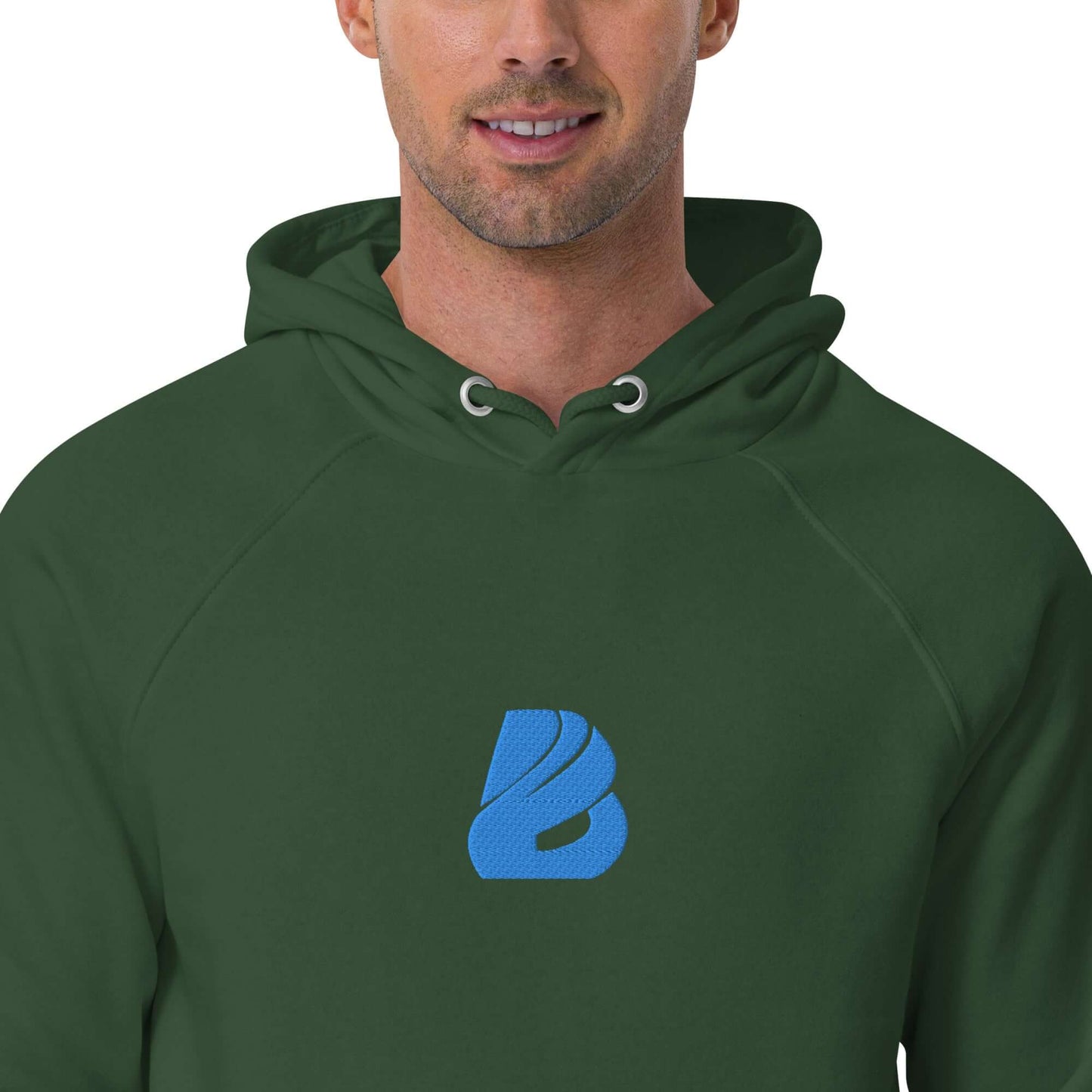 Close-up of a person wearing an Unisex Bio-Raglan-Hoodie N°3 in green with a blue logo on the chest.