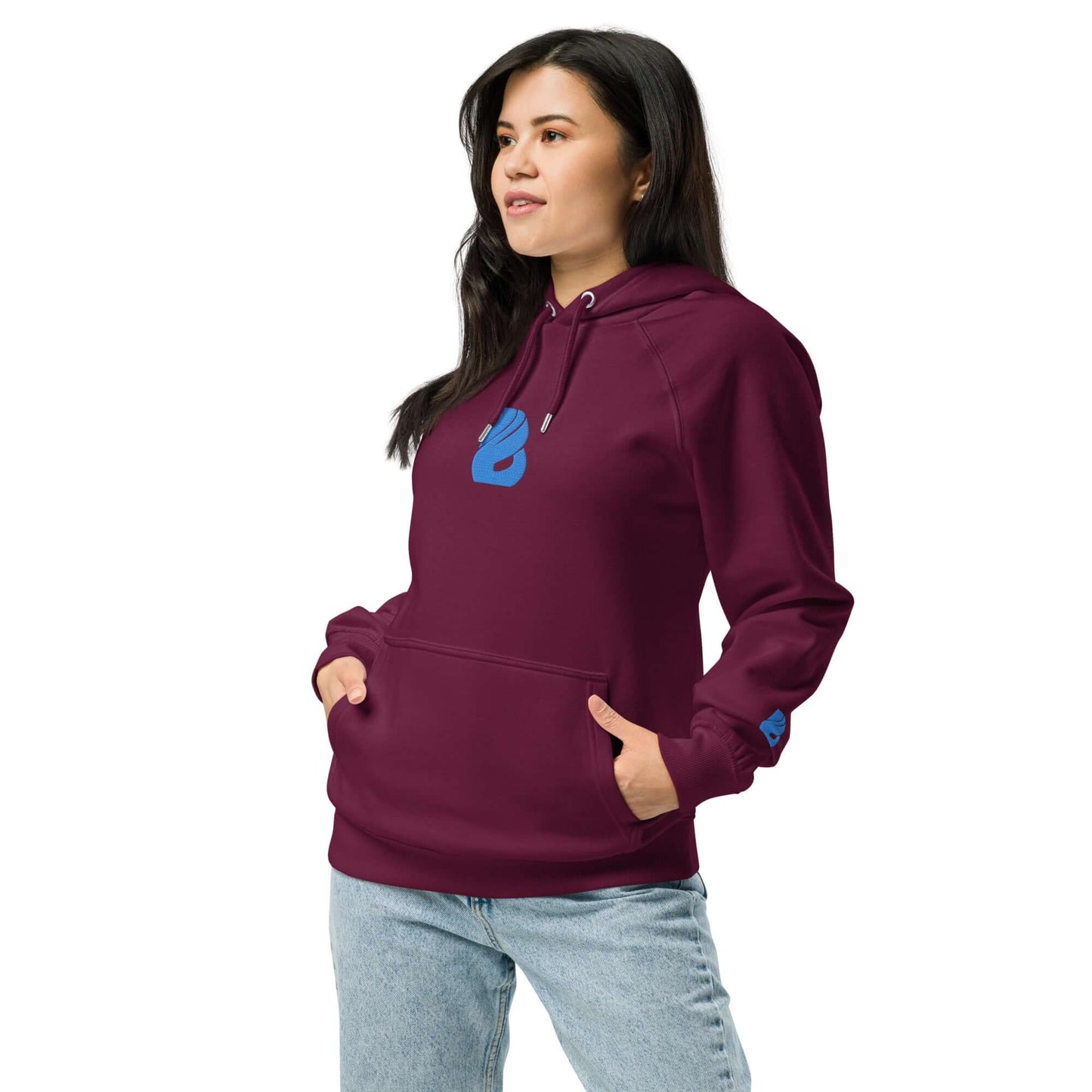 Woman wearing Unisex Bio-Raglan-Hoodie N°3 in burgundy with pockets and blue design, showcasing comfort and casual style.