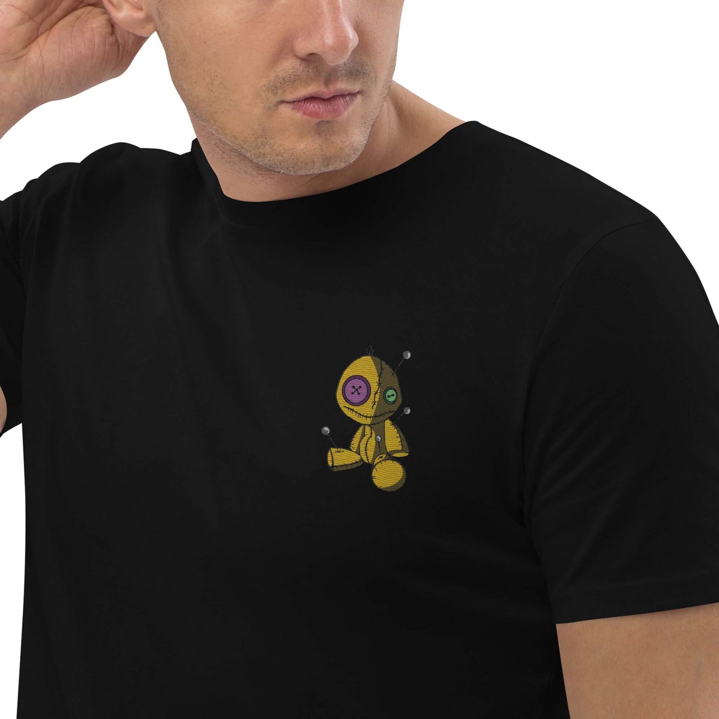 Unisex-Bio-Baumwoll-T-Shirt N°1 in black featuring a unique stitched toy graphic on the front; eco-friendly and stylish design.