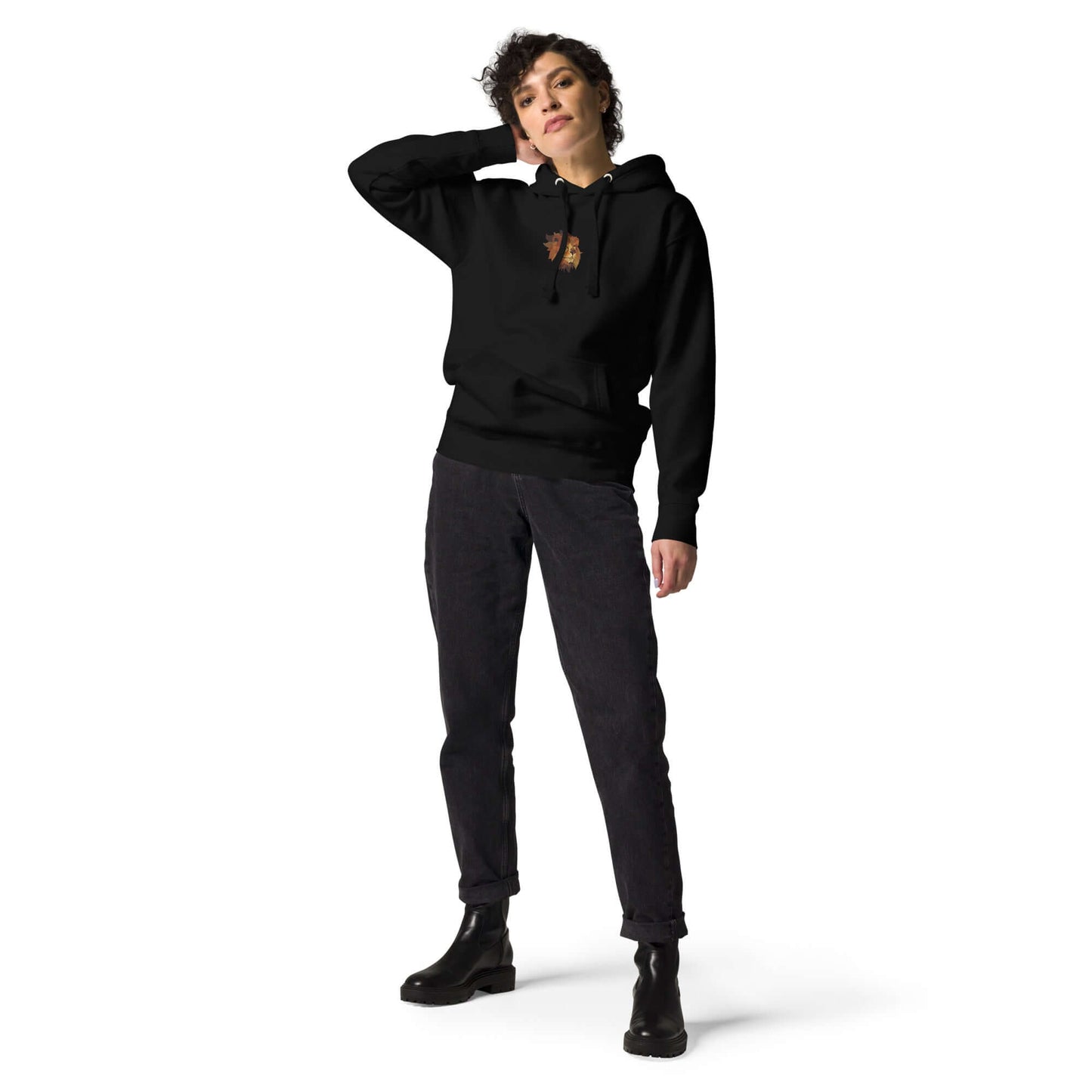 Person wearing Unisex-Kapuzenpullover N°48 with kangaroo pocket and hood, stylish black design, suitable for cool evenings.