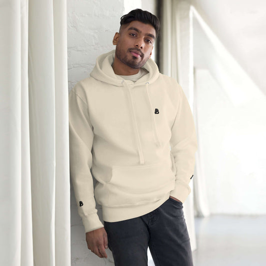 Man wearing Unisex-Kapuzenpullover N°49 with soft cotton blend and front pocket in a stylish setting.
