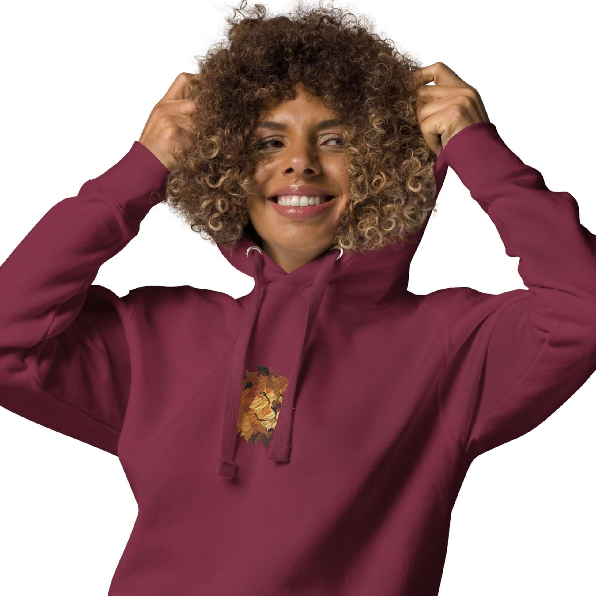 Person wearing Unisex-Kapuzenpullover N°48 with comfortable kangaroo pocket and warm hood, showing a stylish lion design.