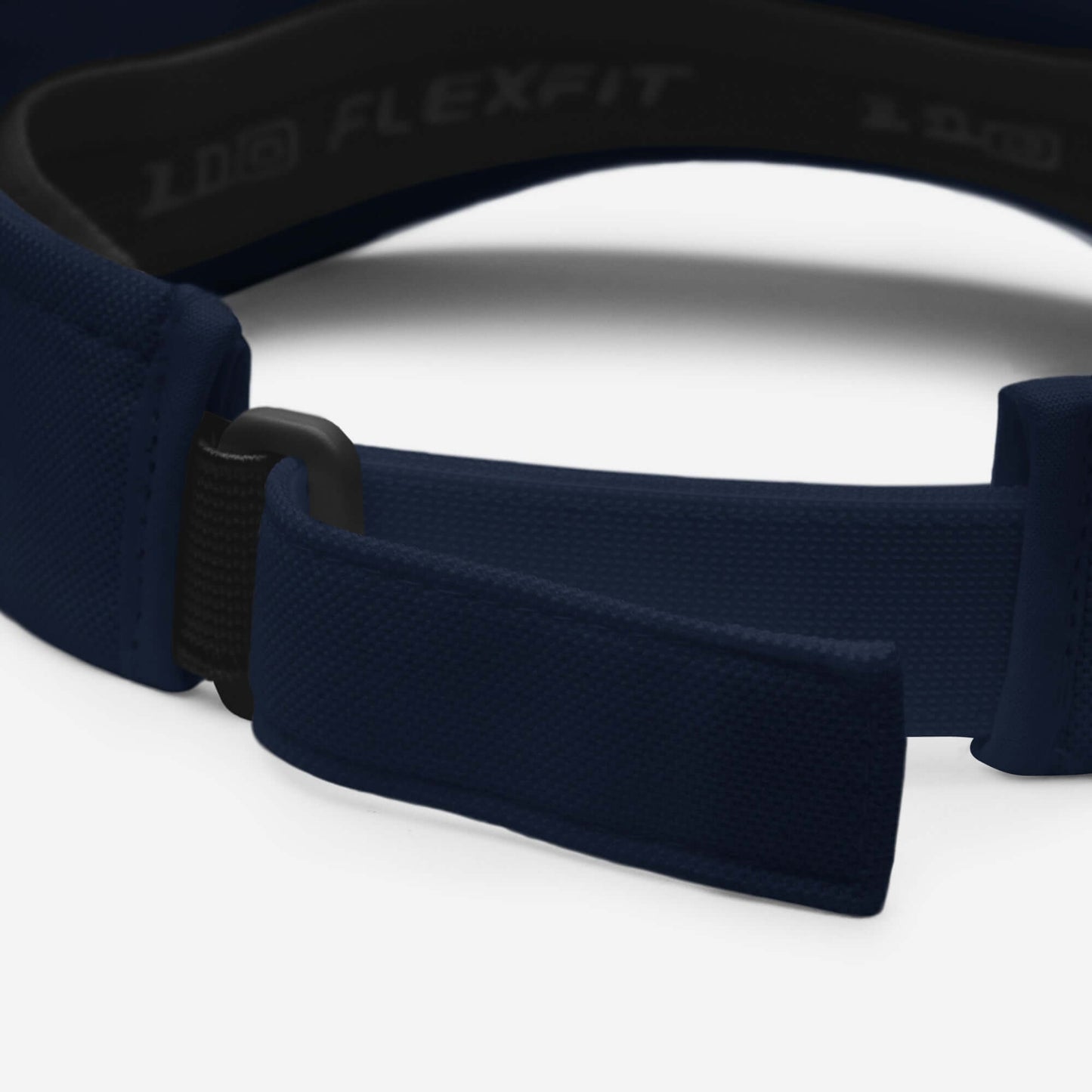 Close-up of Visor N°1 showing adjustable velcro strap in navy color.